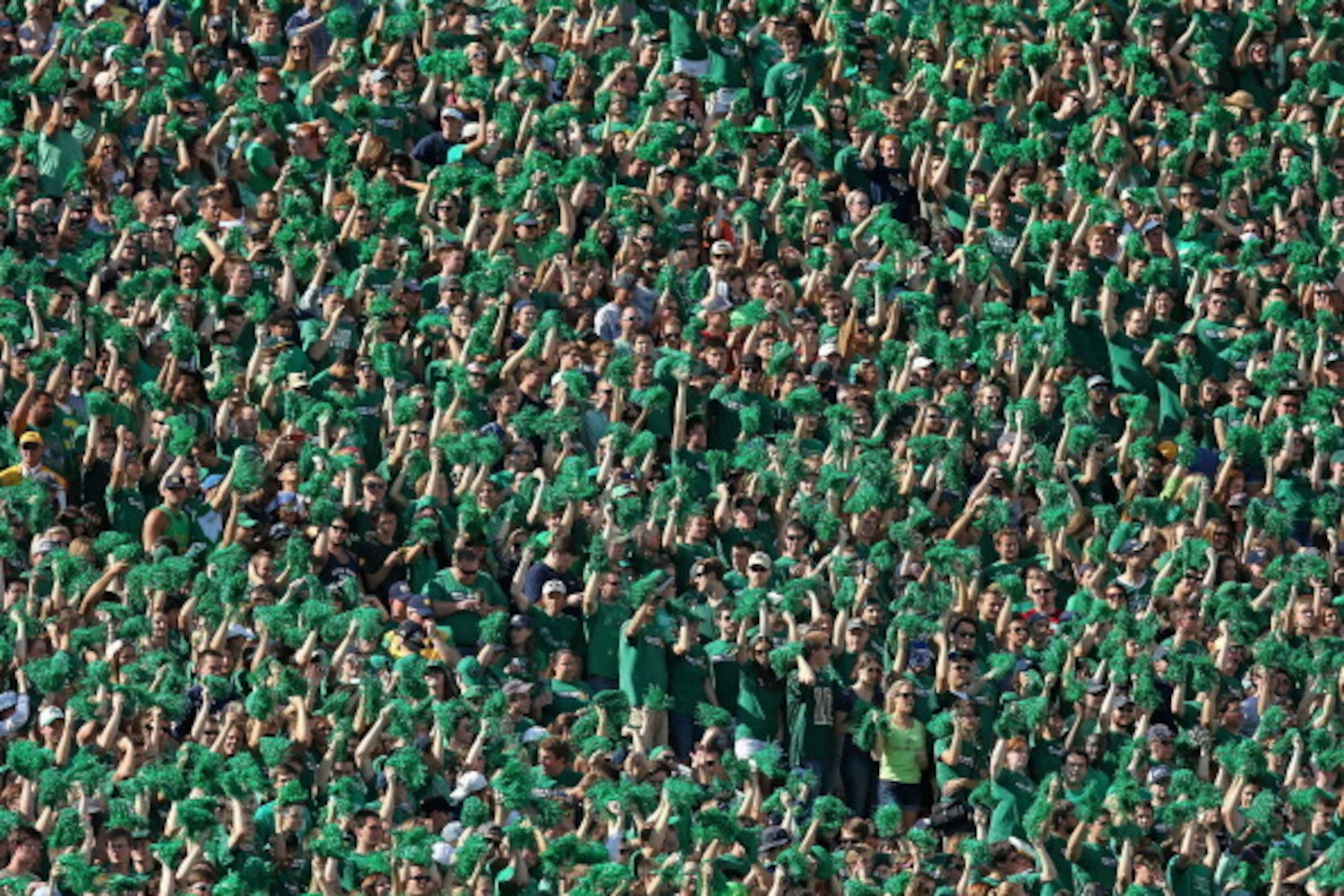 SOUTH BEND, IN - SEPTEMBER 28: Fans in the student section cheer as the Notre Dame Fighting Irish take on the Oklahoma Sooners at Notre Dame Stadium on September 28, 2013 in South Bend, Indiana. Oklahoma defeated Notre Dame 35-21. (Photo by Jonathan Danie