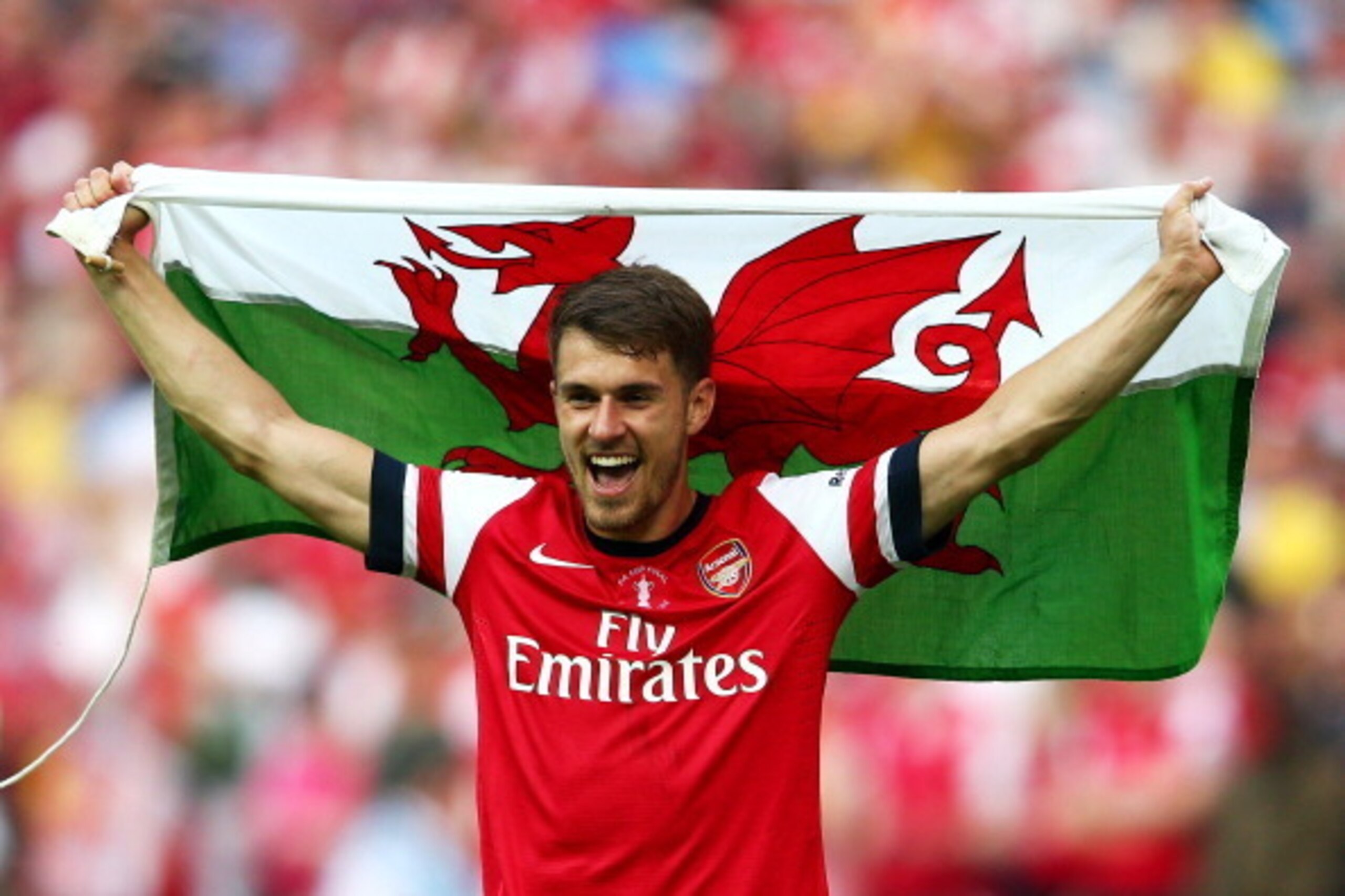 LONDON, ENGLAND - MAY 17:  Aaron Ramsey of Arsenal celebrates victory after the FA Cup with Budweiser Final match between Arsenal and Hull City at Wembley Stadium on May 17, 2014 in London, England.  (Photo by Clive Mason/Getty Images)