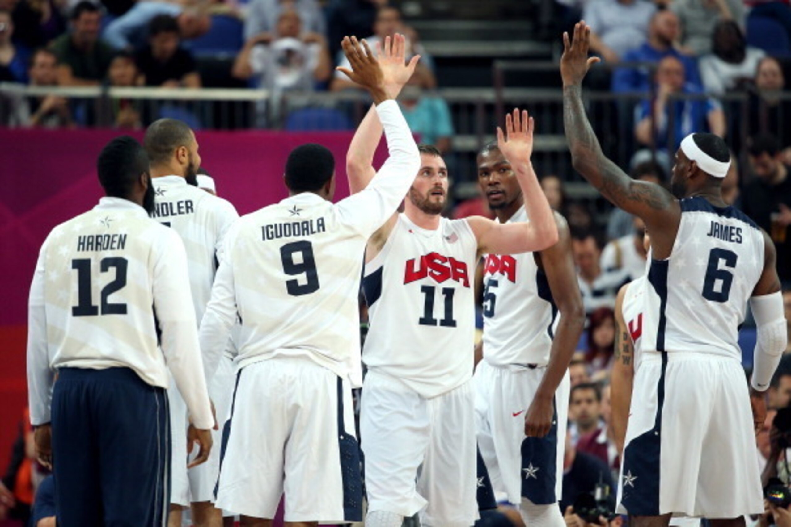 LONDON, ENGLAND - AUGUST 08:  Andre Iguodala #9, Kevin Love #11 and LeBron James #6 of United States celebrate late in the fourth quarter while taking on Australia during the Men's Basketball quaterfinal game on Day 12 of the London 2012 Olympic Games at 