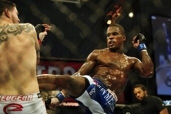 Nov 6, 2013; Fort Campbell, KY, USA; Chris Camozzi (red gloves) fights Lorenz Larkin (blue gloves) in the middleweight bout during UFC Fight for the Troops at Fort Campbell. Mandatory Credit: Joshua Lindsey-USA TODAY Sports