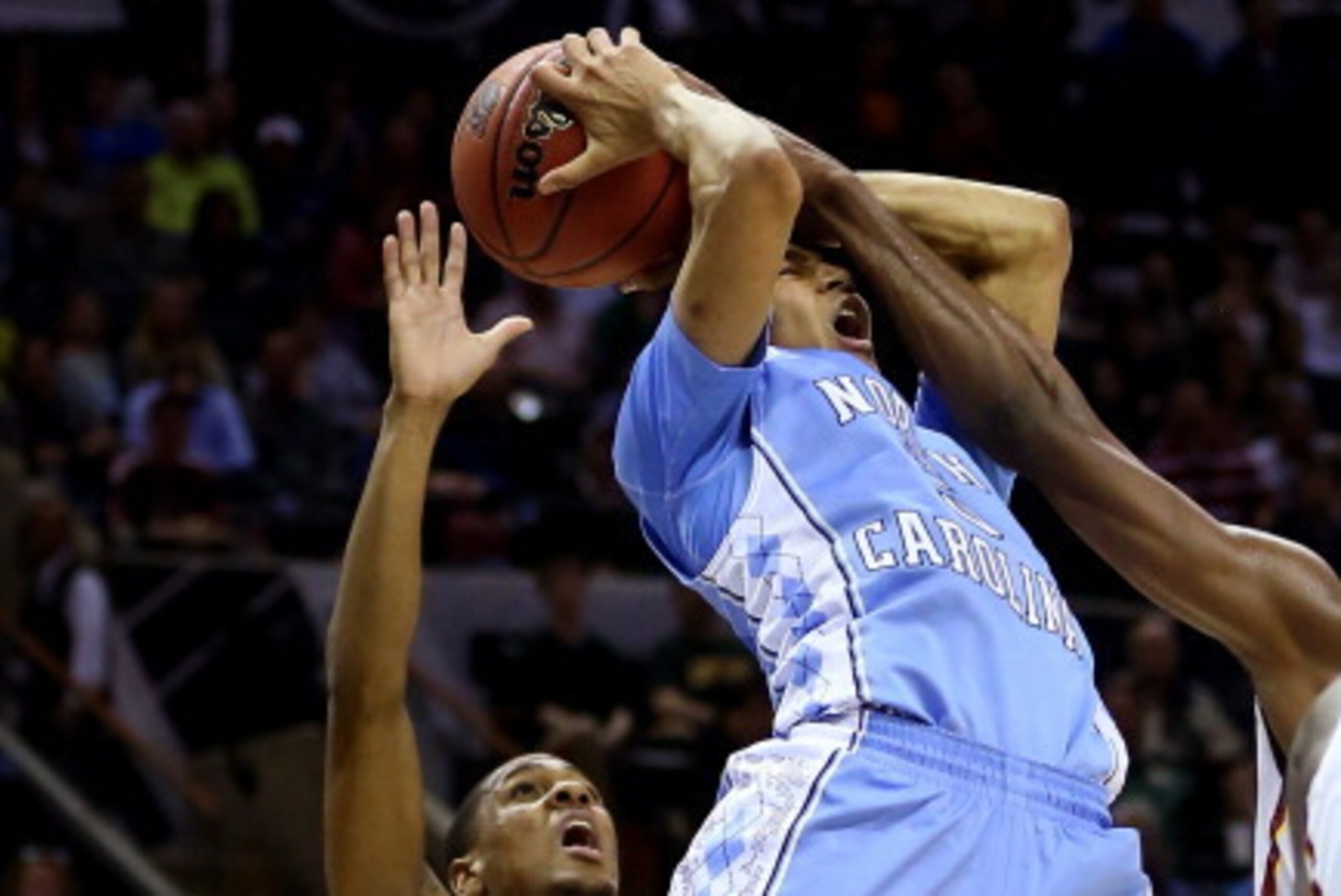 SAN ANTONIO, TX - MARCH 23: Marcus Paige #5 of the North Carolina Tar Heels goes to the basket as Monte Morris #11 of the Iowa State Cyclones defends during the third round of the 2014 NCAA Men's Basketball Tournament at the AT&T Center on March 23, 2014 