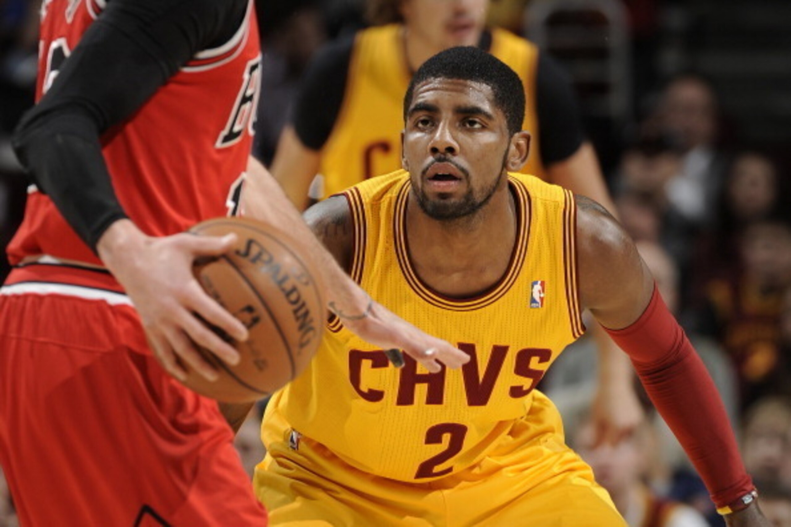 CLEVELAND, OH - NOVEMBER 30:  Kyrie Irving #2 of the Cleveland Cavaliers defends against Kirk Hinrich #12 of the Chicago Bulls at The Quicken Loans Arena on November 30, 2013 in Cleveland, Ohio. NOTE TO USER: User expressly acknowledges and agrees that, b