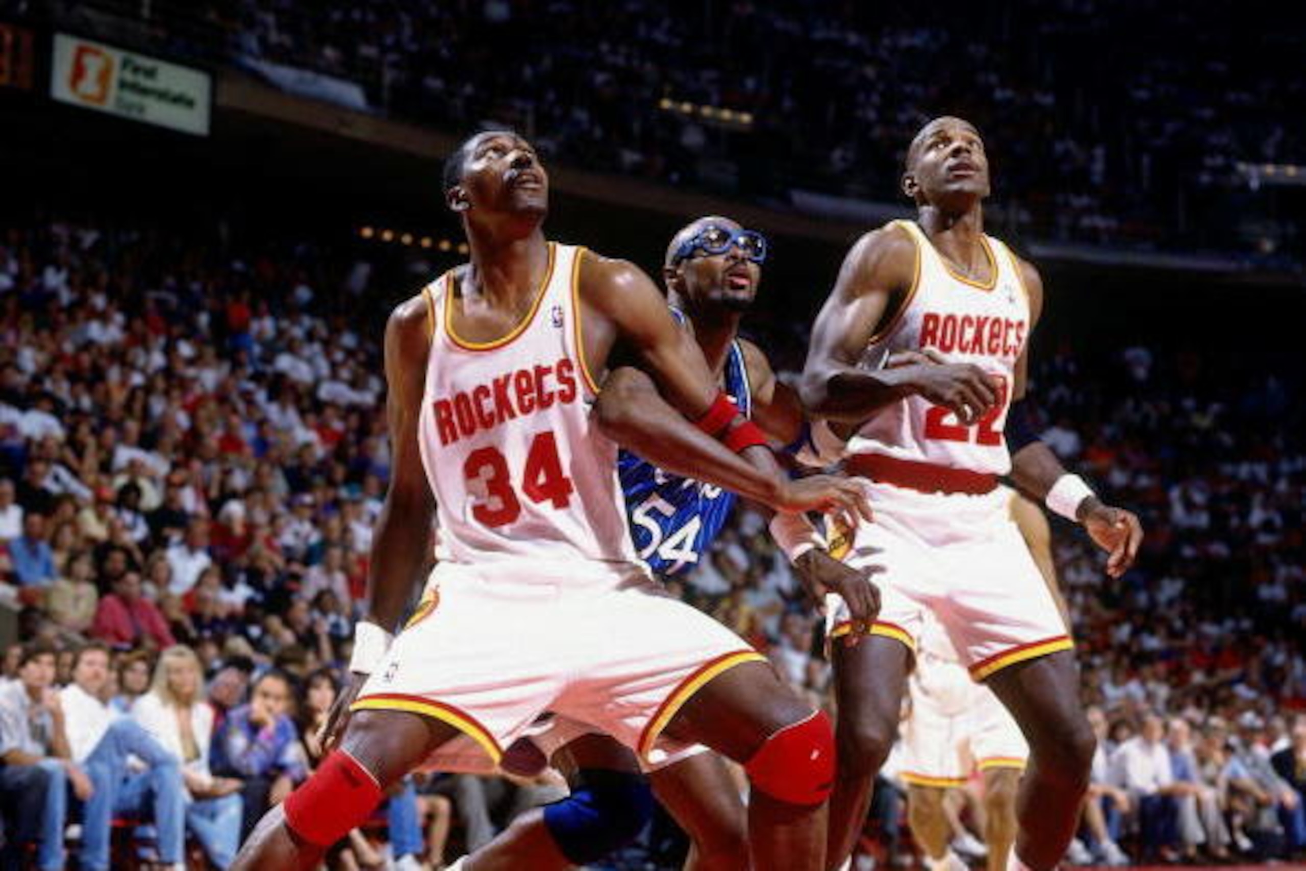 HOUSTON - JUNE 11:  Hakeem Olajuwon #34 of the Houston Rockets boxes out against Horace Grant #54 of the Orlando Magic in Game Three of the 1995 NBA Finals at the Summit on June 11, 1995 in Houston, Texas.  The Rockets won 106-103.  NOTE TO USER: User exp