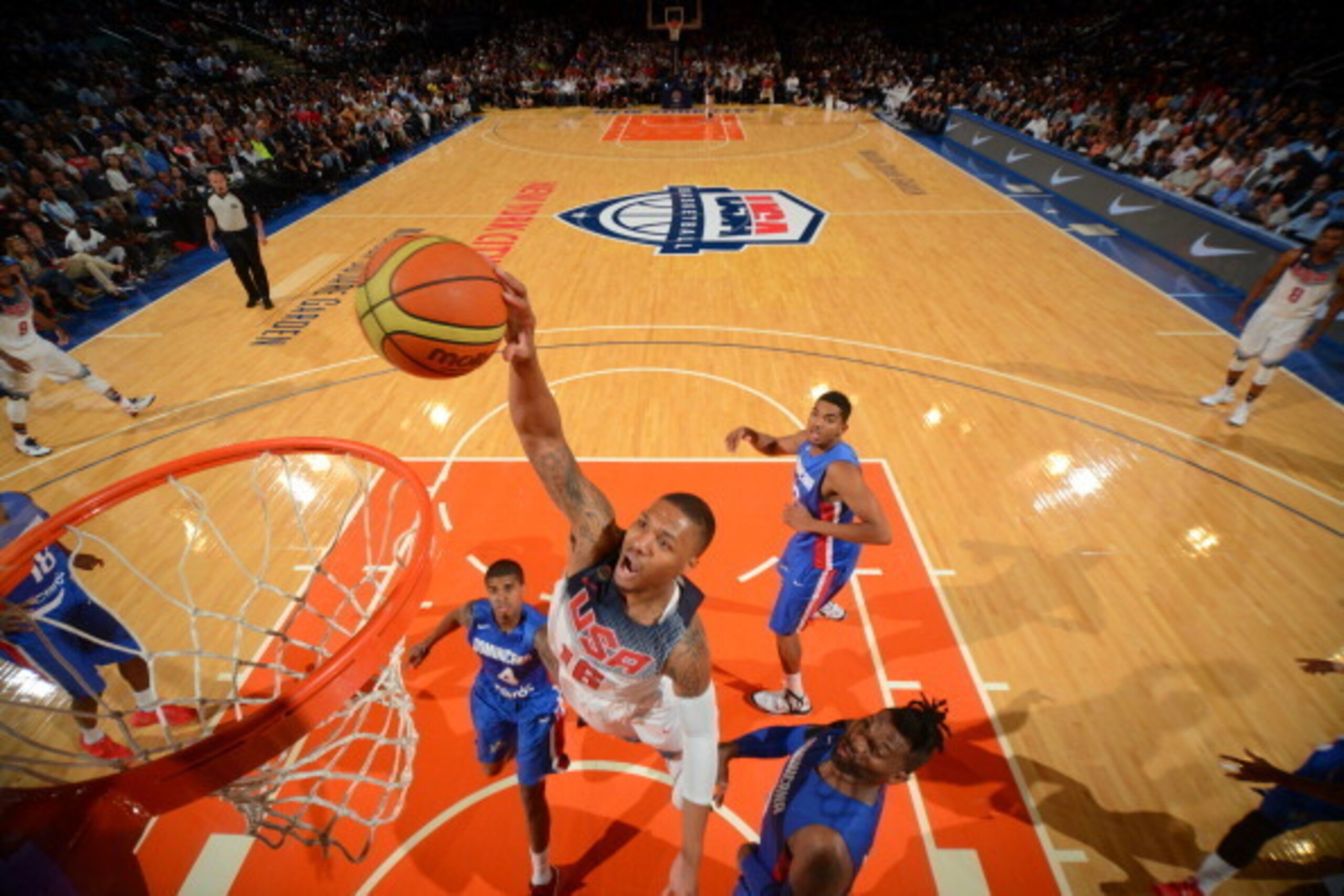 NEW YORK, NY - AUGUST 20: Damian Lillard #16 of the USA Basketball Men's National Team dunks against the Dominican Republic National Team on August 20, 2014 at Madison Square Garden in New York City.  NOTE TO USER: User expressly acknowledges and agrees t