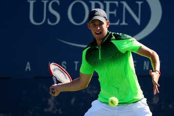 NEW YORK, NY - AUGUST 29:  Dominic Thiem of Austria returns a shot against Ernests Gulbis of Latvia during their men's singles second round match on Day Five of the 2014 US Open at the USTA Billie Jean King National Tennis Center on August 29, 2014 in the