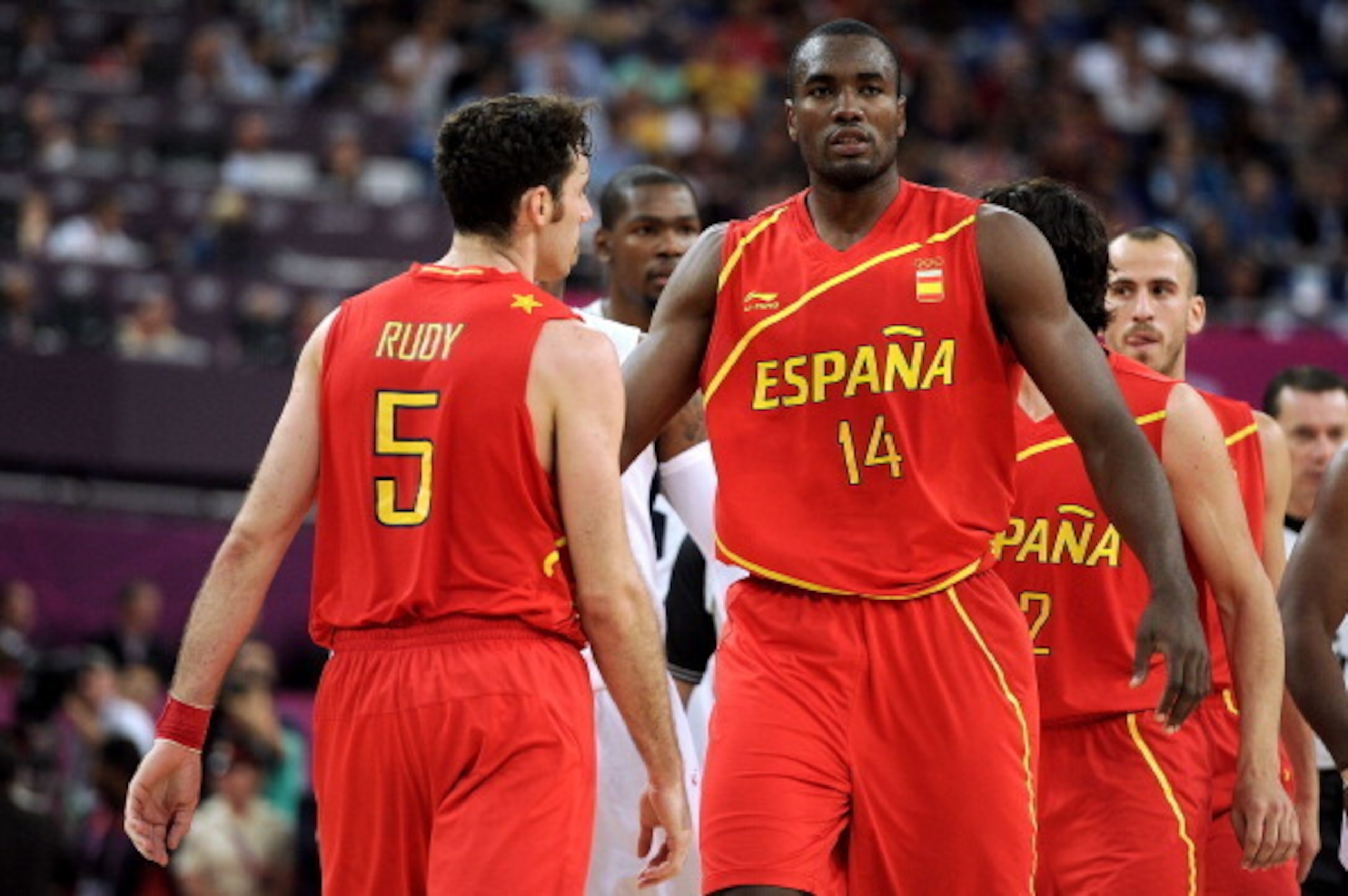 LONDON, ENGLAND - AUGUST 12: Serge Ibaka #14 of Spain looks on with team mate Rudy Fernandez #5 of Spain during the Men's Basketball gold medal game between the United States and Spain on Day 16 of the London 2012 Olympics Games at North Greenwich Arena o LONDON, ENGLAND - AUGUST 12: Serge Ibaka #14 of Spain looks on with team mate Rudy Fernandez #5 of Spain during the Men's Basketball gold medal game between the United States and Spain on Day 16 of the London 2012 Olympics Games at North Greenwich Arena o