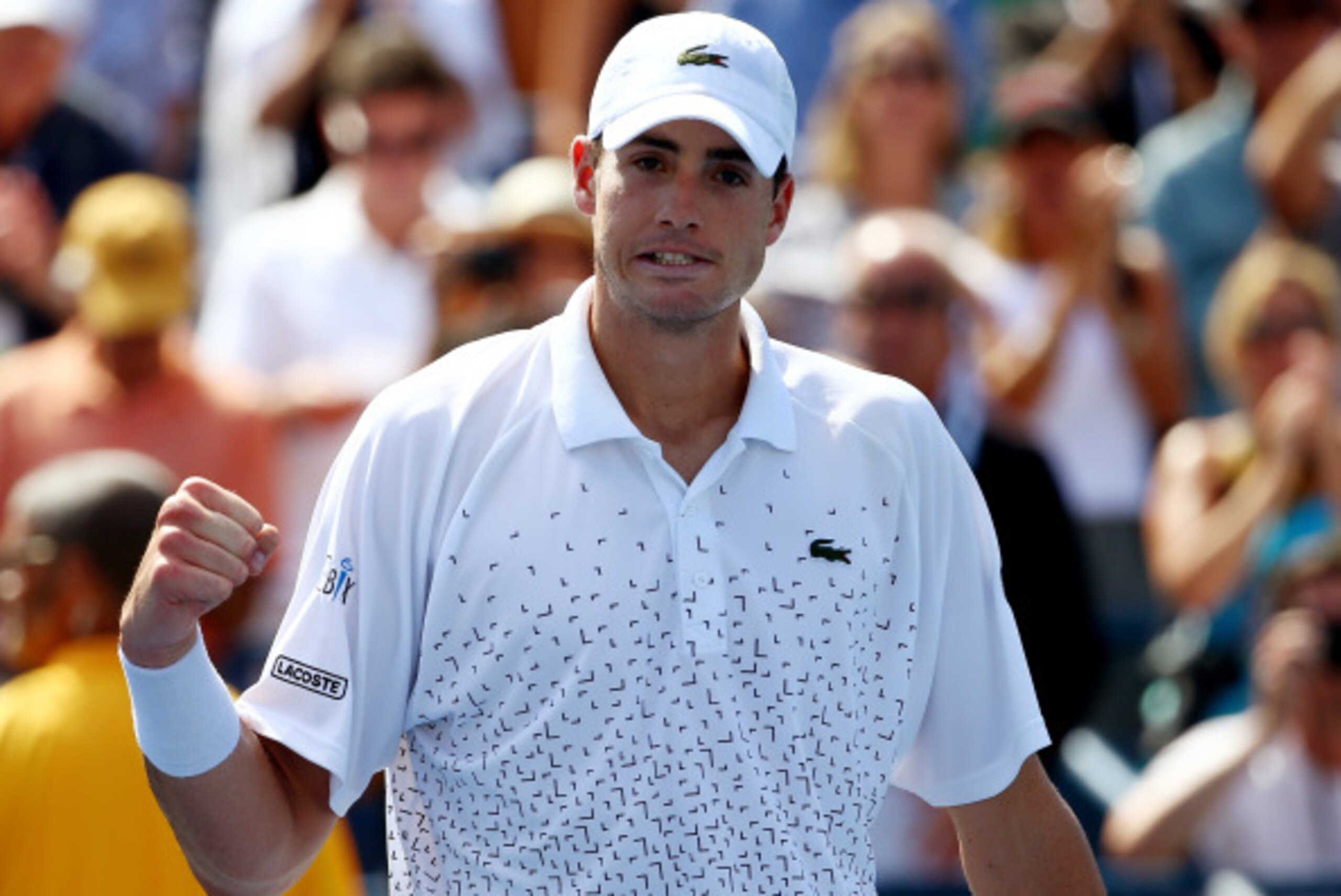 NEW YORK, NY - AUGUST 28:  John Isner of the United States reacts after defeating Jan-Lennard Struff of Germany during their men's singles second round match on Day Four of the 2014 US Open at the USTA Billie Jean King National Tennis Center on August 28,