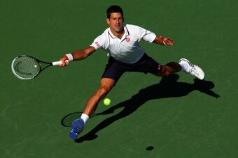 NEW YORK, NY - AUGUST 28:  Novak Djokovic of Serbia returns a shot against Paul-Henri Mathieu of France during their men's second round match on Day Four of the 2014 US Open at the USTA Billie Jean King National Tennis Center on August 28, 2014 in the Flu