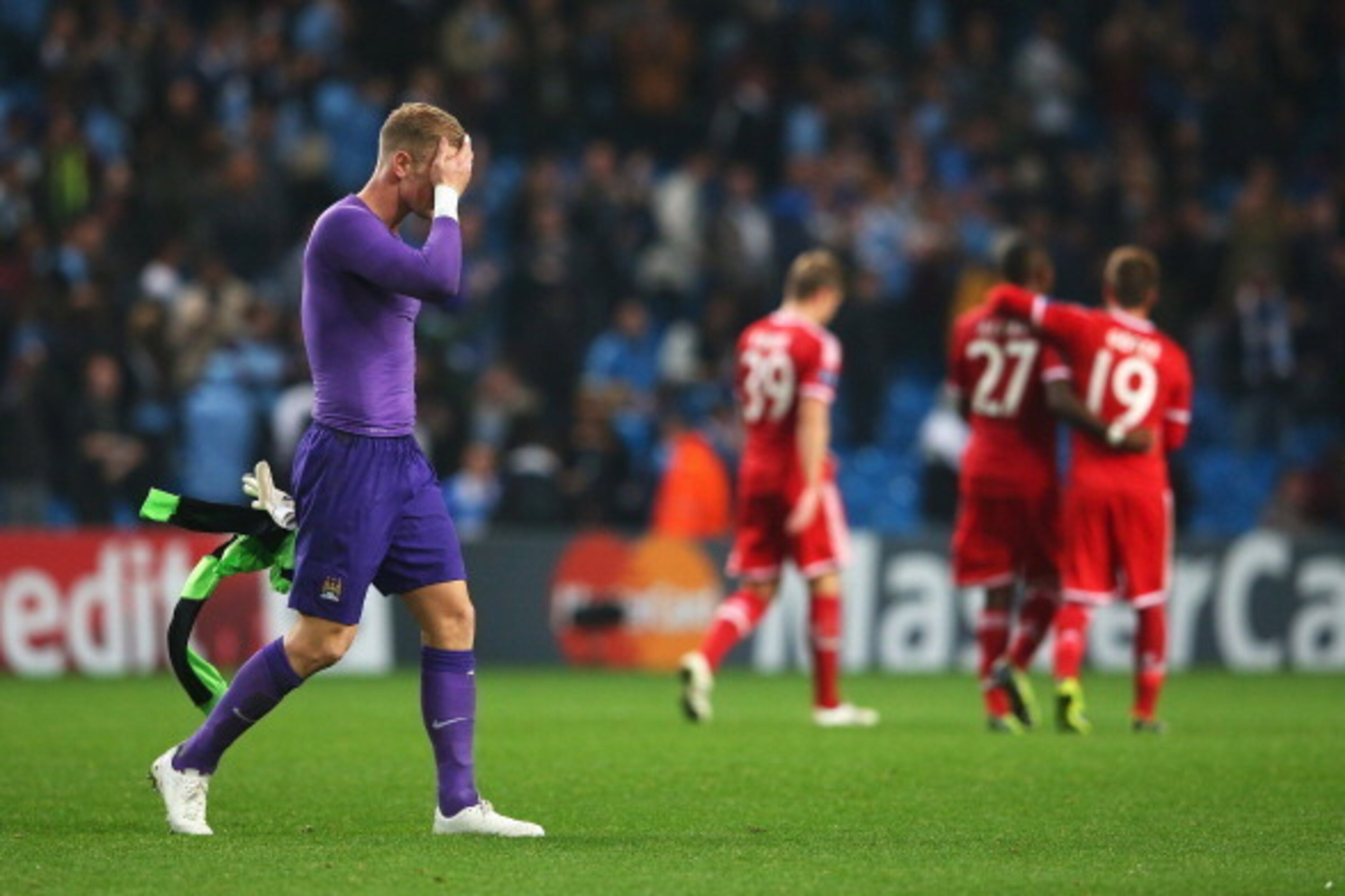 MANCHESTER, ENGLAND - OCTOBER 02:  Goalkeeper Joe Hart of Manchester City holds his head as he walks off after the UEFA Champions League Group D match between Manchester City and FC Bayern Muenchen at Etihad Stadium on October 2, 2013 in Manchester, Engla