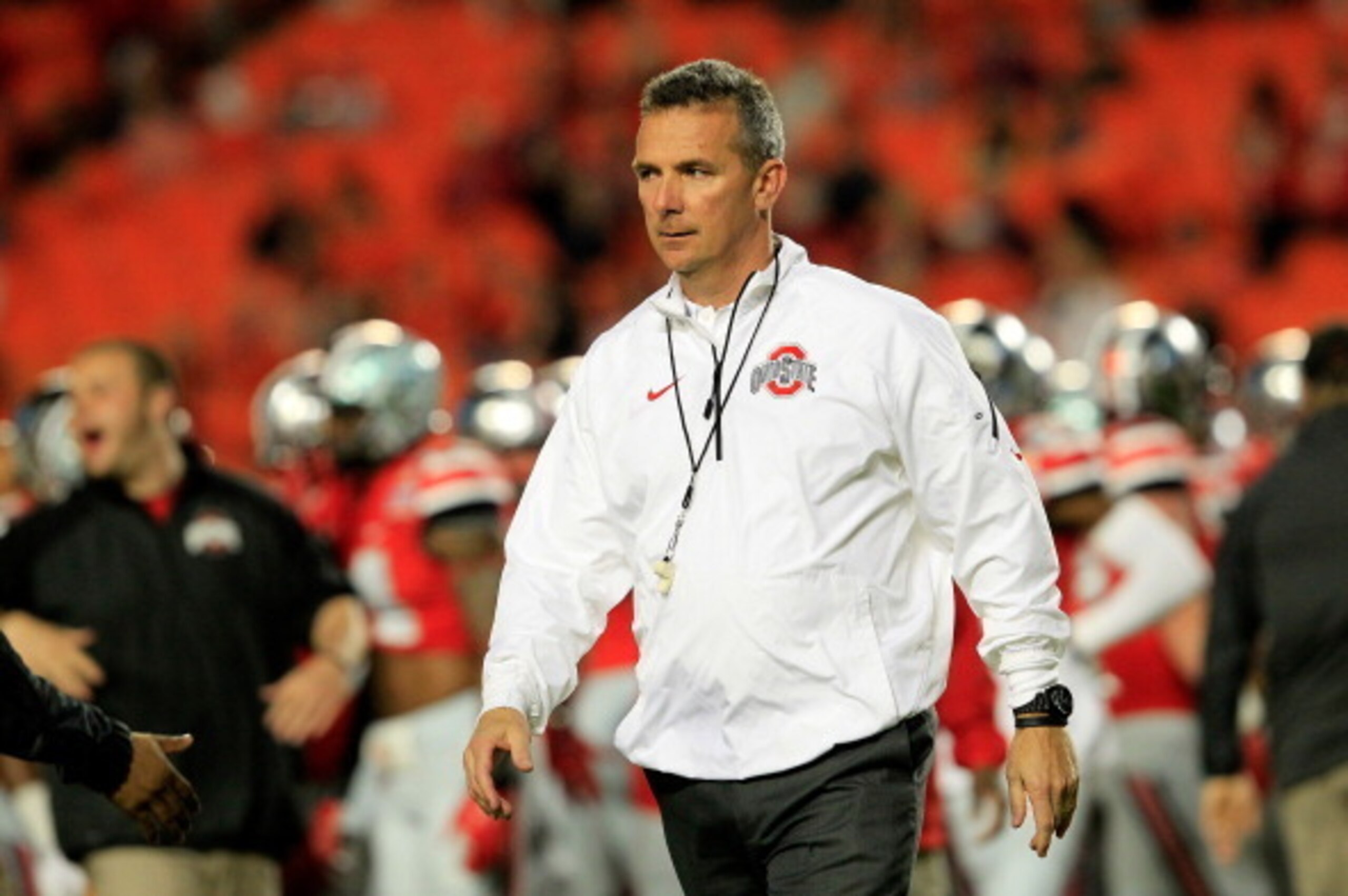 MIAMI GARDENS, FL - JANUARY 03:  Head coach Urban Meyer of the Ohio State Buckeyes looks on during warm ups prior to the Discover Orange Bowl against the Clemson Tigers at Sun Life Stadium on January 3, 2014 in Miami Gardens, Florida.  (Photo by Chris Tro