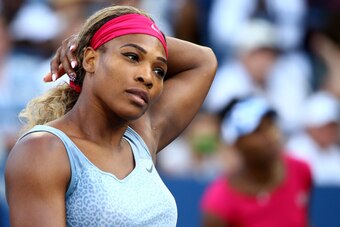 NEW YORK, NY - AUGUST 28:  Serena Williams (L) and Venus Williams of the United States play their women's doubles match against Timea Babos of Hungary Kristina Mladenovic of France on Day Four of the 2014 US Open at the USTA Billie Jean King National Tenn