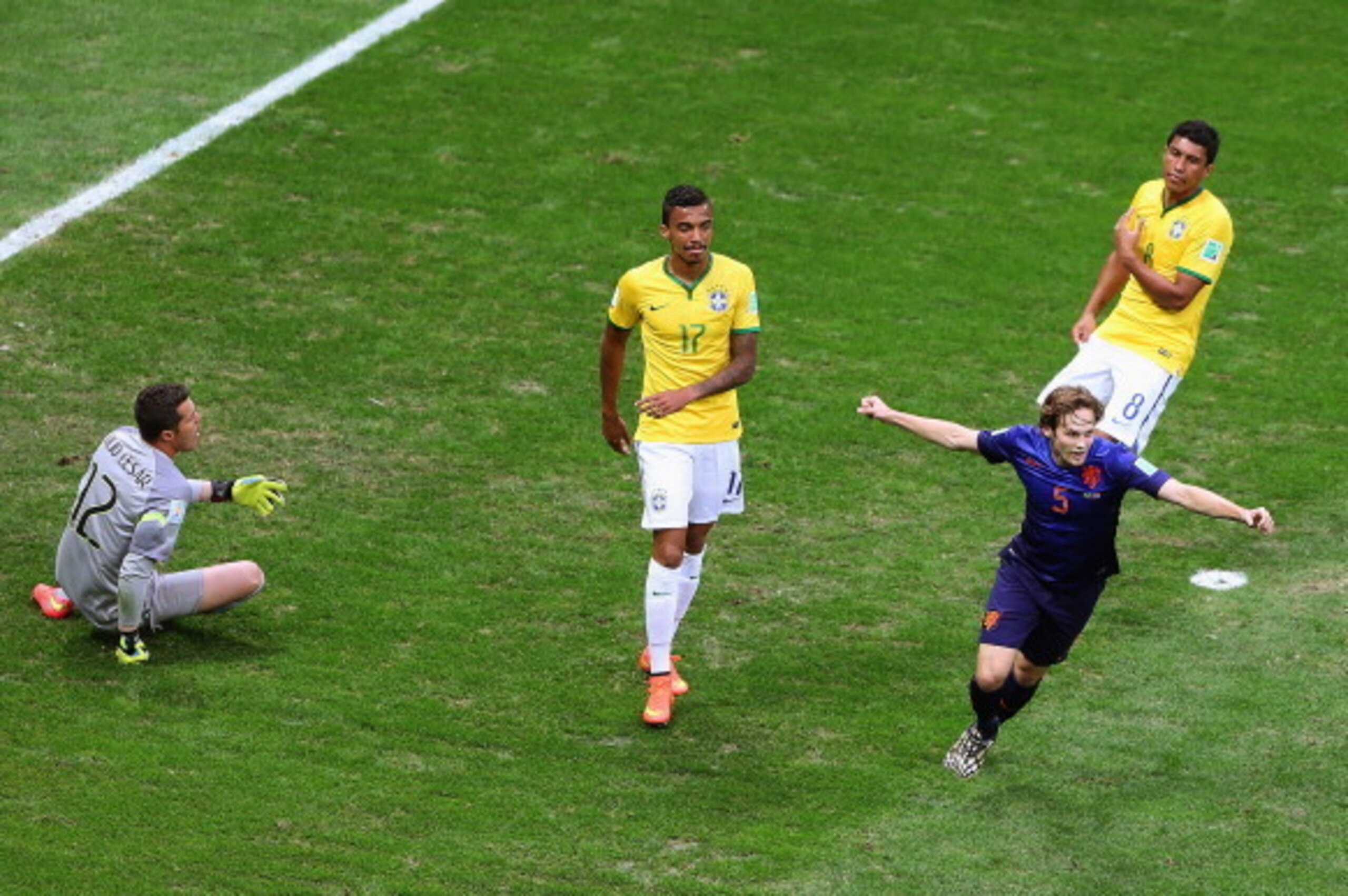 BRASILIA, BRAZIL - JULY 12: Daley Blind of the Netherlands celebrates scoring his team's second goal as goalkeeper Julio Cesar (L), Luiz Gustavo (C) and Paulinho of Brazil react during the 2014 FIFA World Cup Brazil Third Place Playoff match between Brazi