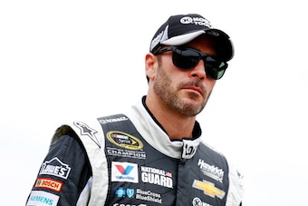 INDIANAPOLIS, IN - JULY 26:  Jimmie Johnson, driver of the #48 Lowe's / Kobalt Tools Chevrolet, looks on from the grid during qualifying for the NASCAR Sprint Cup Series Crown Royal Presents The John Wayne Walding 400 at the Brickyard Indianapolis Motor S