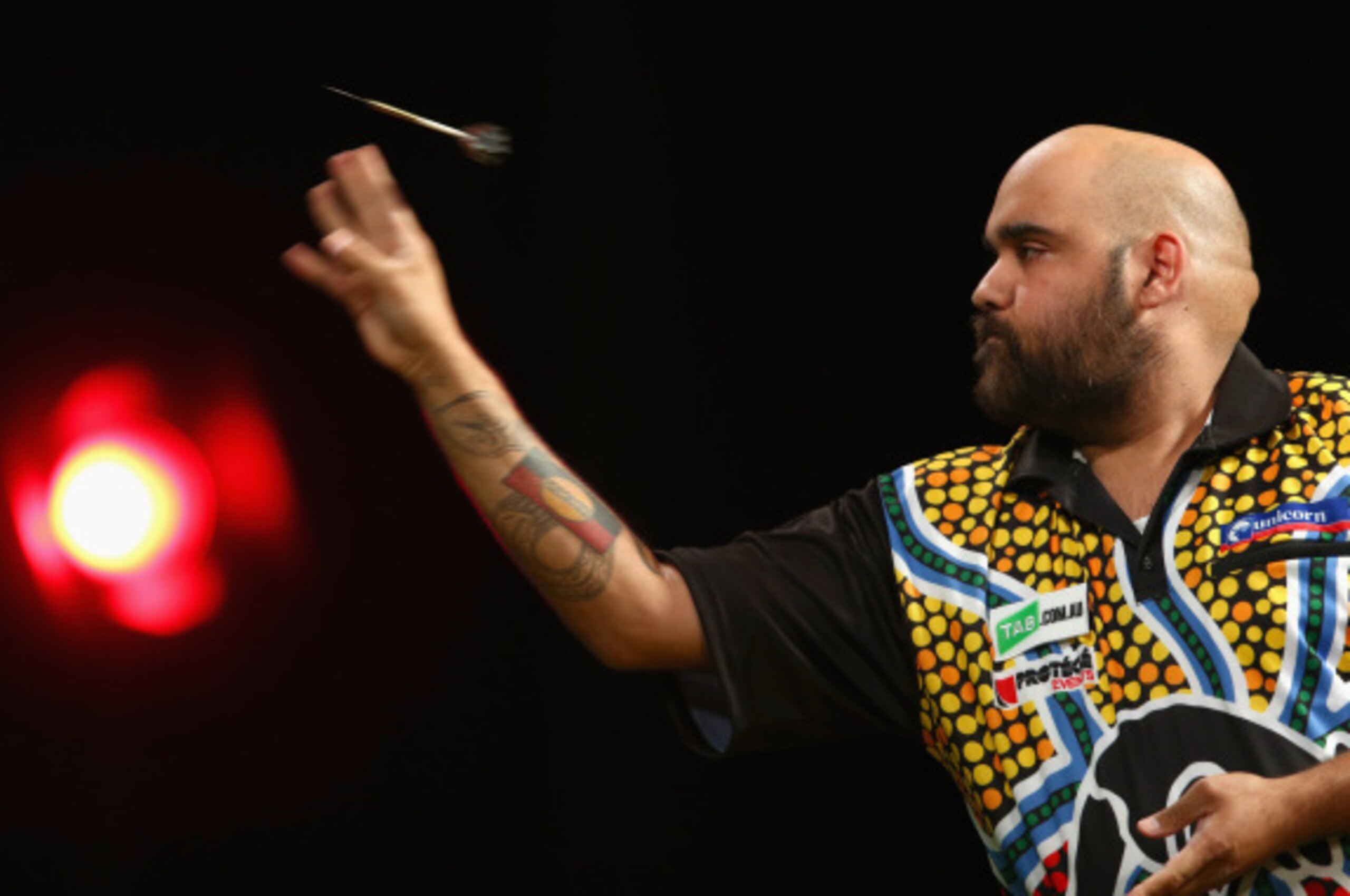 SYDNEY, AUSTRALIA - AUGUST 29:  Kyle Anderson of Australia competes during his quarter-final match against Simon Whitlock of Australia during the Sydney Darts Masters at Hordern Pavilion on August 29, 2014 in Sydney, Australia.  (Photo by Mark Kolbe/Getty