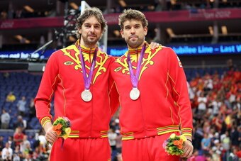 LONDON, ENGLAND - AUGUST 12:  Silver medallist Pau Gasol #4 of Spain and Marc Gasol #13 of Spain pose on the podium during the medal ceremony for the Men's Basketball on Day 16 of the London 2012 Olympics Games at North Greenwich Arena on August 12, 2012 