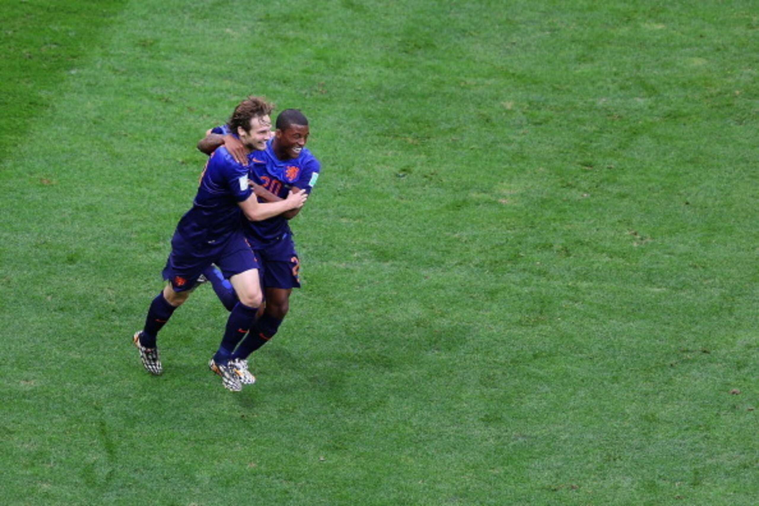 BRASILIA, BRAZIL - JULY 12:  Daley Blind of the Netherlands celebrates with Georginio Wijnaldum  scoring his team's second goal during the 2014 FIFA World Cup Brazil Third Place Playoff match between Brazil and the Netherlands at Estadio Nacional on July 