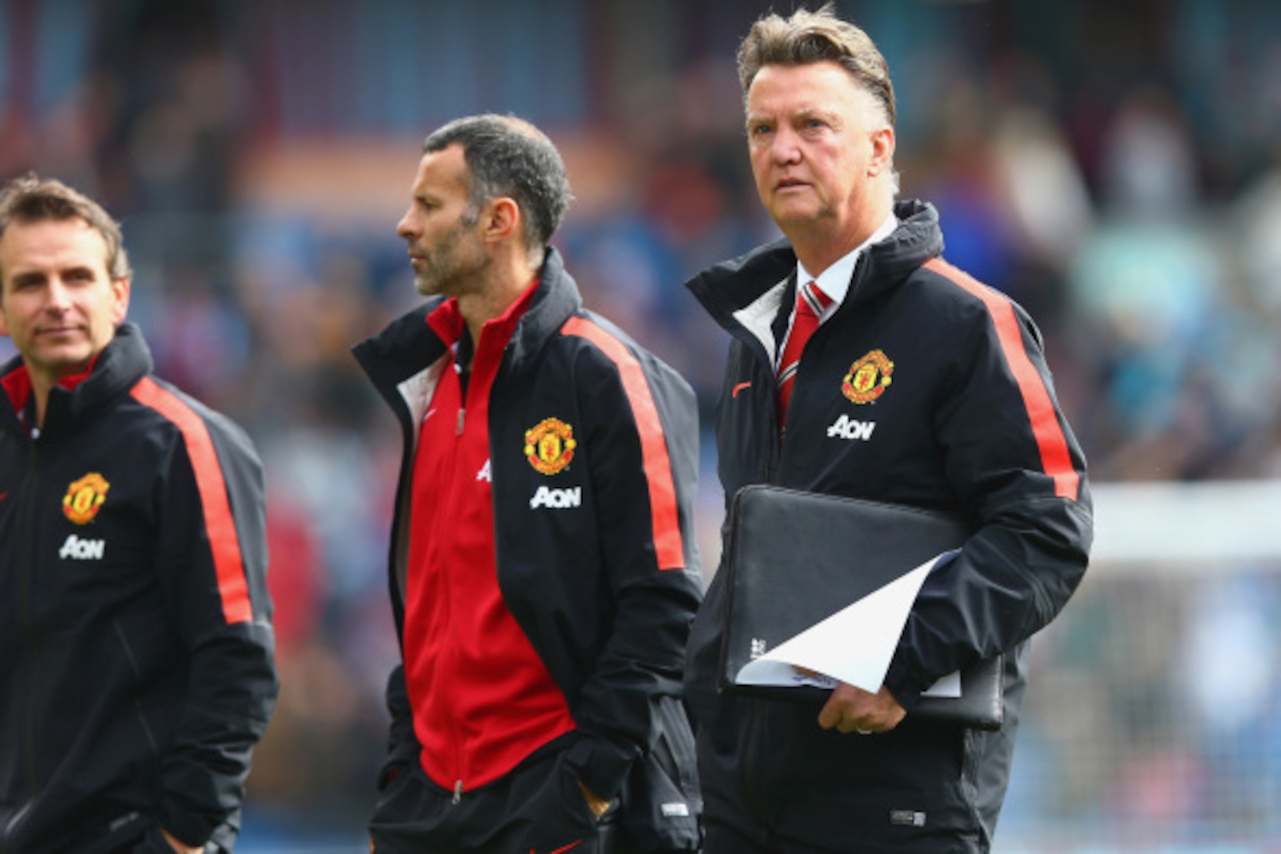 BURNLEY, ENGLAND - AUGUST 30:  Assistant Ryan Giggs of Manchester United and Manager Louis van Gaal of Manchester United look on during the Barclays Premier League match between Burnley and Manchester United at Turf Moor on August 30, 2014 in Burnley, Eng