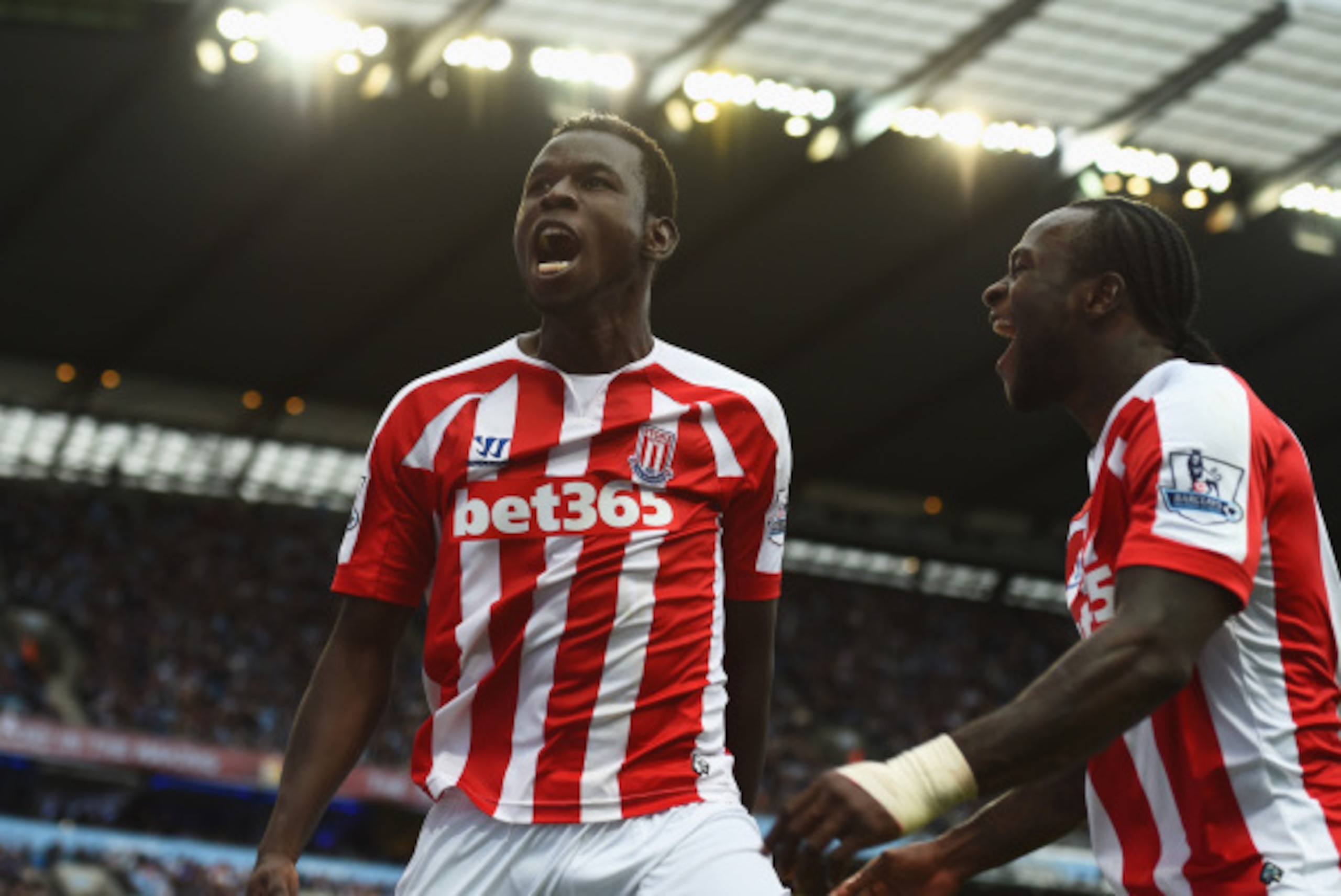 MANCHESTER, ENGLAND - AUGUST 30:  Mame Biram Diouf (L) of Stoke City celebrates scoring the opening goal during the Barclays Premier League match between Manchester City and Stoke City at Etihad Stadium on August 30, 2014 in Manchester, England.  (Photo b