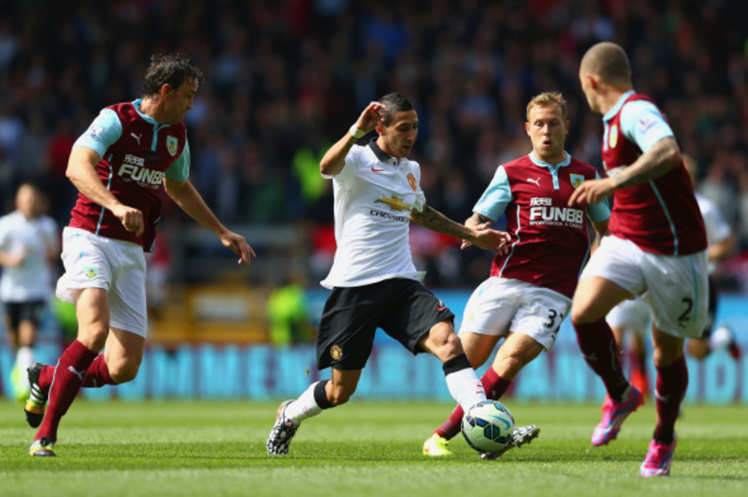 BURNLEY, ENGLAND - AUGUST 30:  Angel di Maria of Manchester United looks for a way through the Burnley defense during the Barclays Premier League match between Burnley and Manchester United at Turf Moor on August 30, 2014 in Burnley, England.  (Photo by C