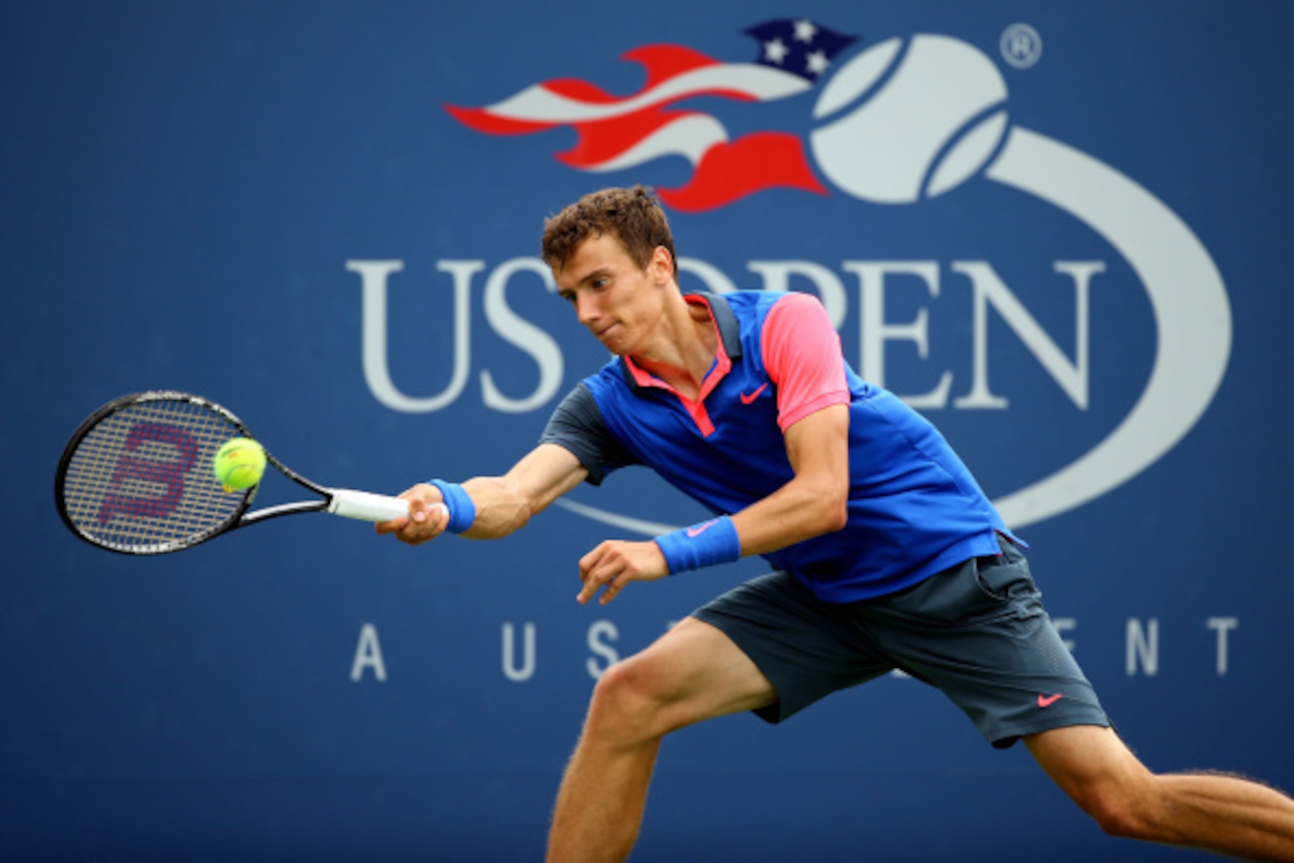NEW YORK, NY - AUGUST 30:  Andrey Kuznetsov of Russia returns a shot against Andy Murray of Great Britain during their men's singles third round match on Day Six of the 2014 US Open at the USTA Billie Jean King National Tennis Center on August 30, 2014 in