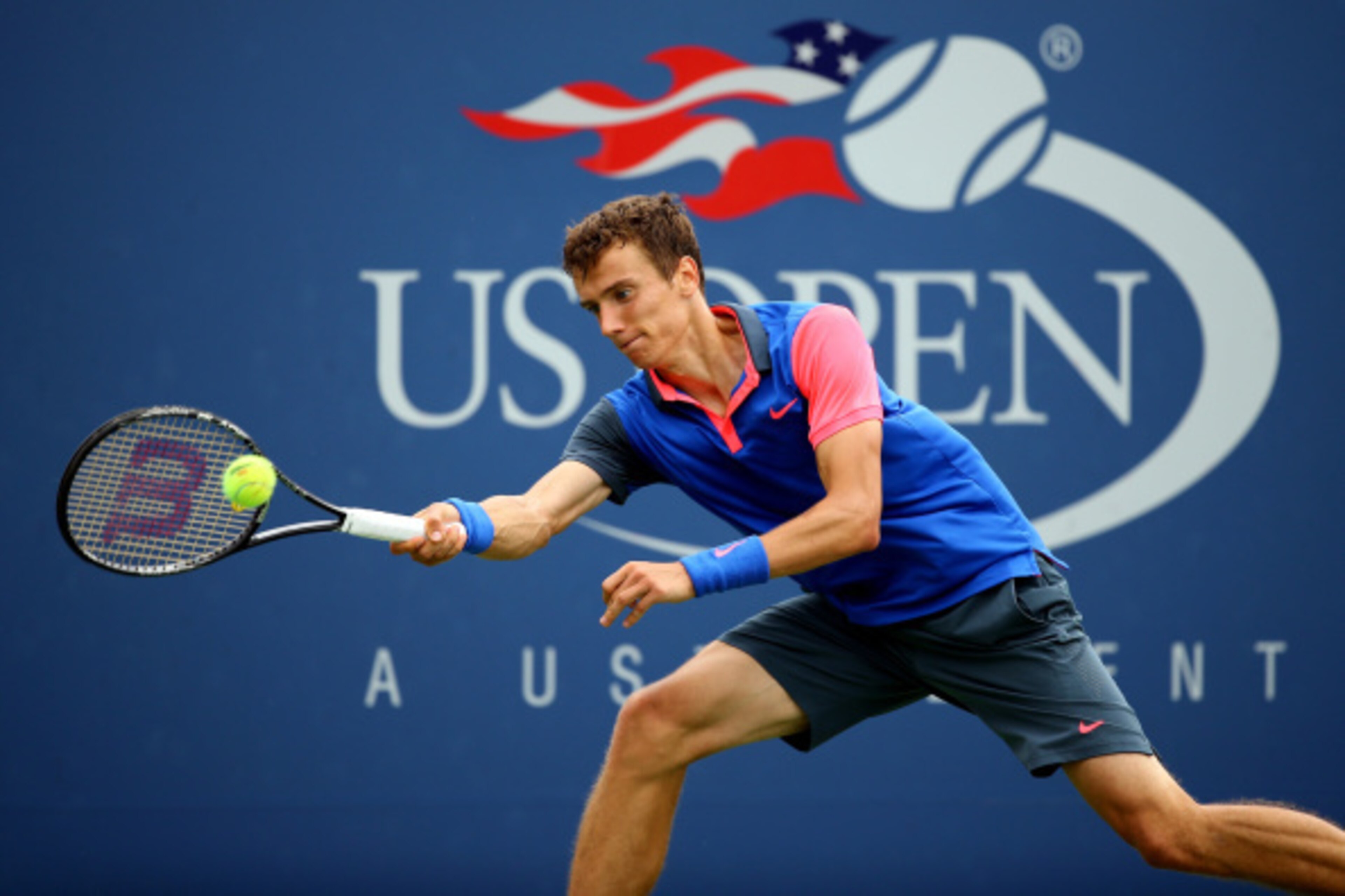 NEW YORK, NY - AUGUST 30:  Andrey Kuznetsov of Russia returns a shot against Andy Murray of Great Britain during their men's singles third round match on Day Six of the 2014 US Open at the USTA Billie Jean King National Tennis Center on August 30, 2014 in