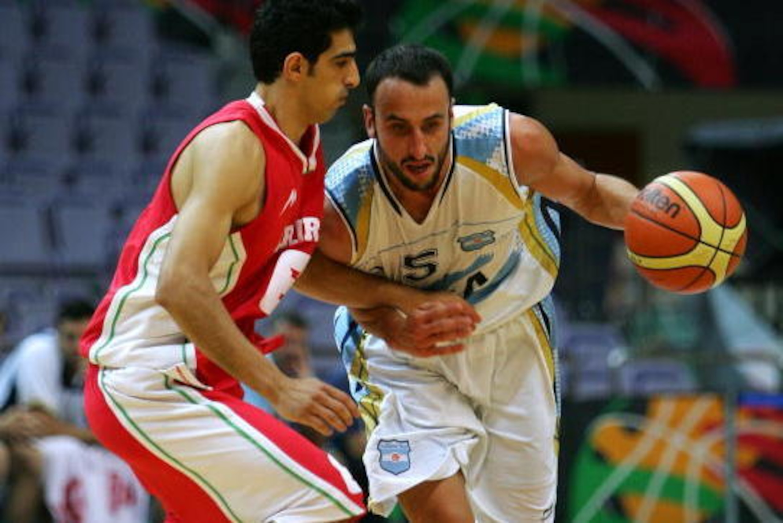 NANJING, CHINA - JULY 29: Emanuel Ginobili (R) of Argentina drives a ball during the FIBA Diamond Ball Basketball Tournament against Iran as a preparation for the upcoming Olympics on July 29, 2008 in Nanjing, China. (Photo by Guang Niu/Getty Images) NANJING, CHINA - JULY 29: Emanuel Ginobili (R) of Argentina drives a ball during the FIBA Diamond Ball Basketball Tournament against Iran as a preparation for the upcoming Olympics on July 29, 2008 in Nanjing, China. (Photo by Guang Niu/Getty Images)