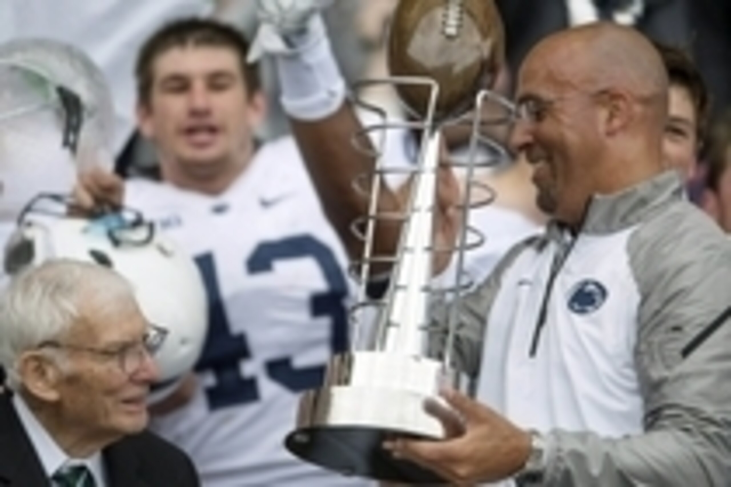 Aug 30, 2014; Dublin, IRL; Dan Rooney presents Penn State Nittany Lions head coach James Franklin with the Dan Rooney trophy after defeating the Central Florida Knights at Croke Park. Mandatory Credit: Steve Flynn-USA TODAY Sports