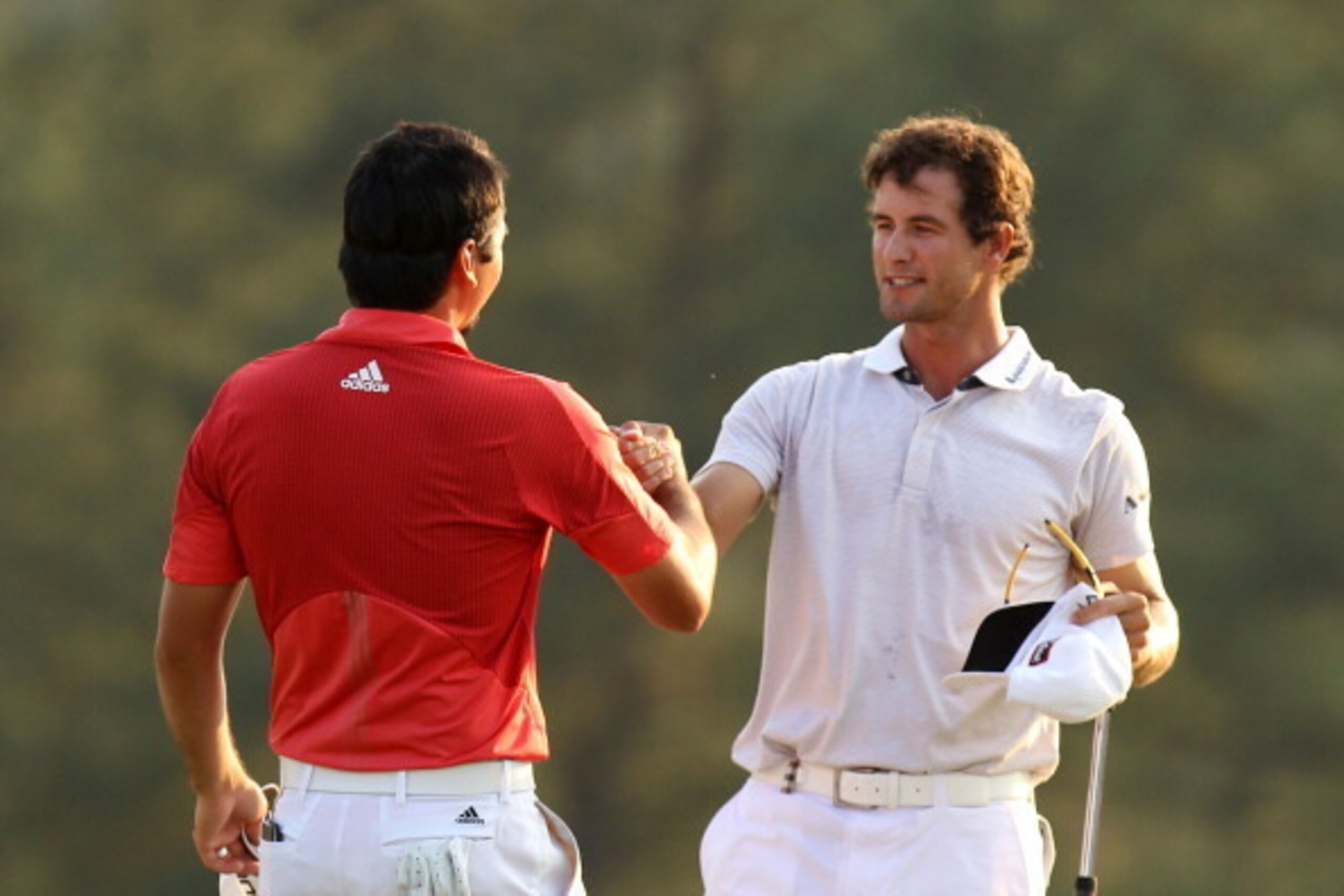 AUGUSTA, GA - APRIL 10:  (L-R) Jason Day of Australia and Adam Scott of Australia congratulate each other on the 18th hole during the final round of the 2011 Masters Tournament at Augusta National Golf Club on April 10, 2011 in Augusta, Georgia.  (Photo b
