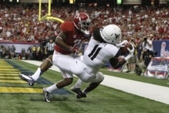 Aug 30, 2014; Atlanta, GA, USA; West Virginia Mountaineers wide receiver Kevin White (11) catches a touchdown pass against Alabama Crimson Tide defensive back Bradley Sylve (3) in the second quarter of the 2014 Chick-fil-A Kickoff Game at the Georgia Dome