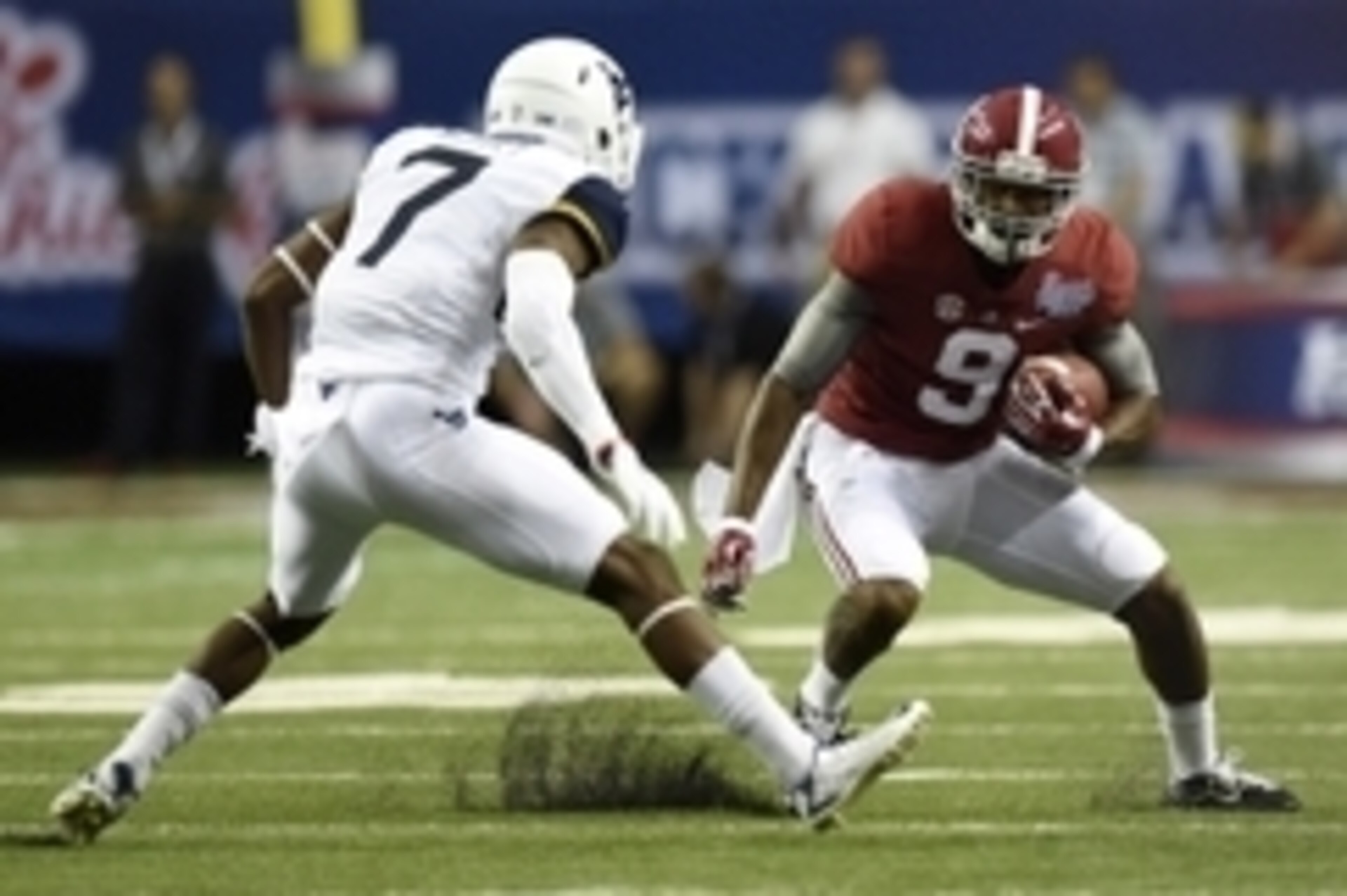Aug 30, 2014; Atlanta, GA, USA; Alabama Crimson Tide wide receiver Amari Cooper (9) runs the ball against West Virginia Mountaineers cornerback Daryl Worley (7) during the first quarter of the 2014 Chick-fil-a kickoff game at Georgia Dome. Mandatory Credi