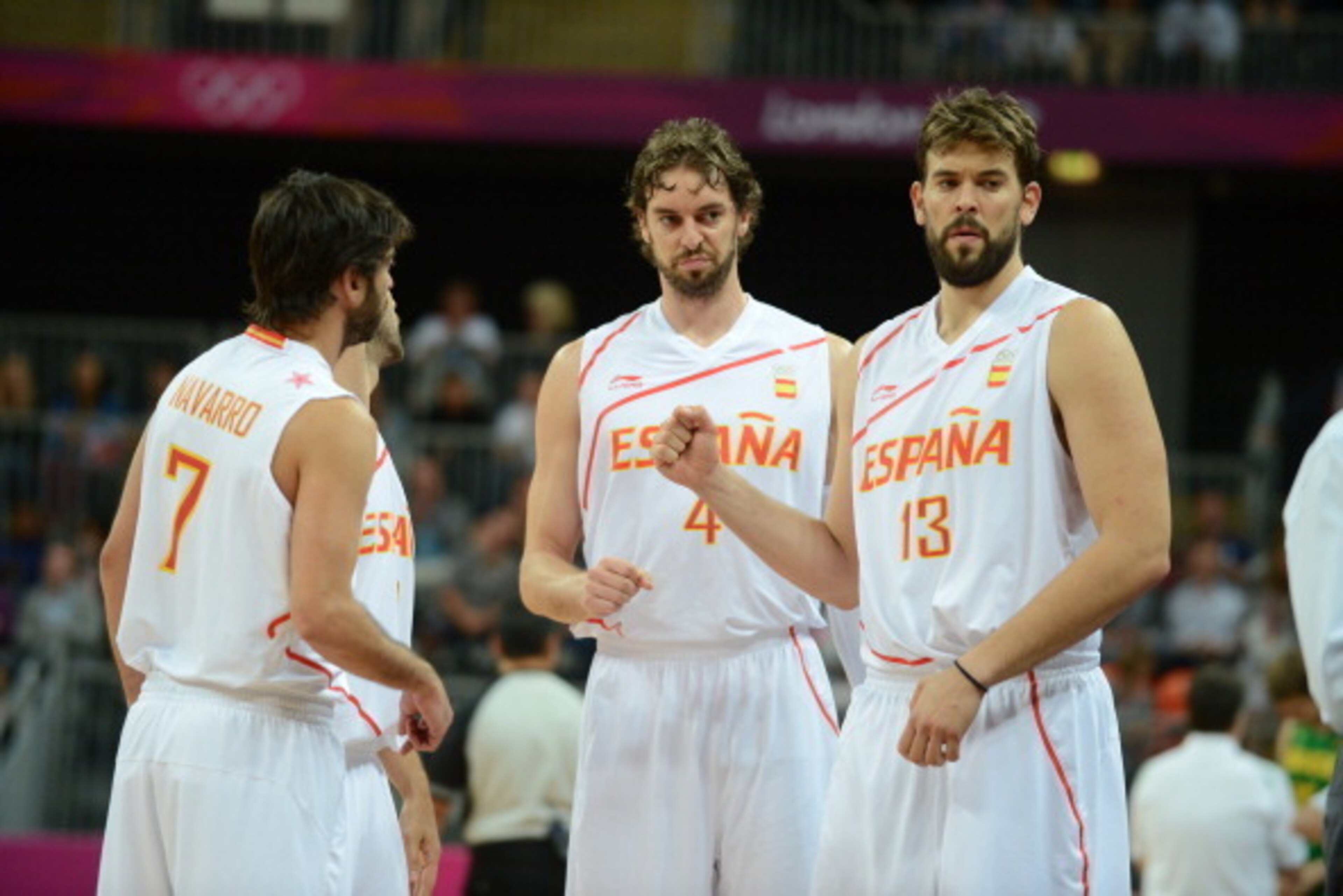 LONDON, ENGLAND - AUGUST 6: Juan-Carlos Navarro #7, Pau Gasol #4 and Marc Gasol #13 of Spain looks on against Brazil during their Men's Basketball Game on Day 10 of the London 2012 Olympic Games at the Olympic Park Basketball Arena on August 6, 2012 in Lo