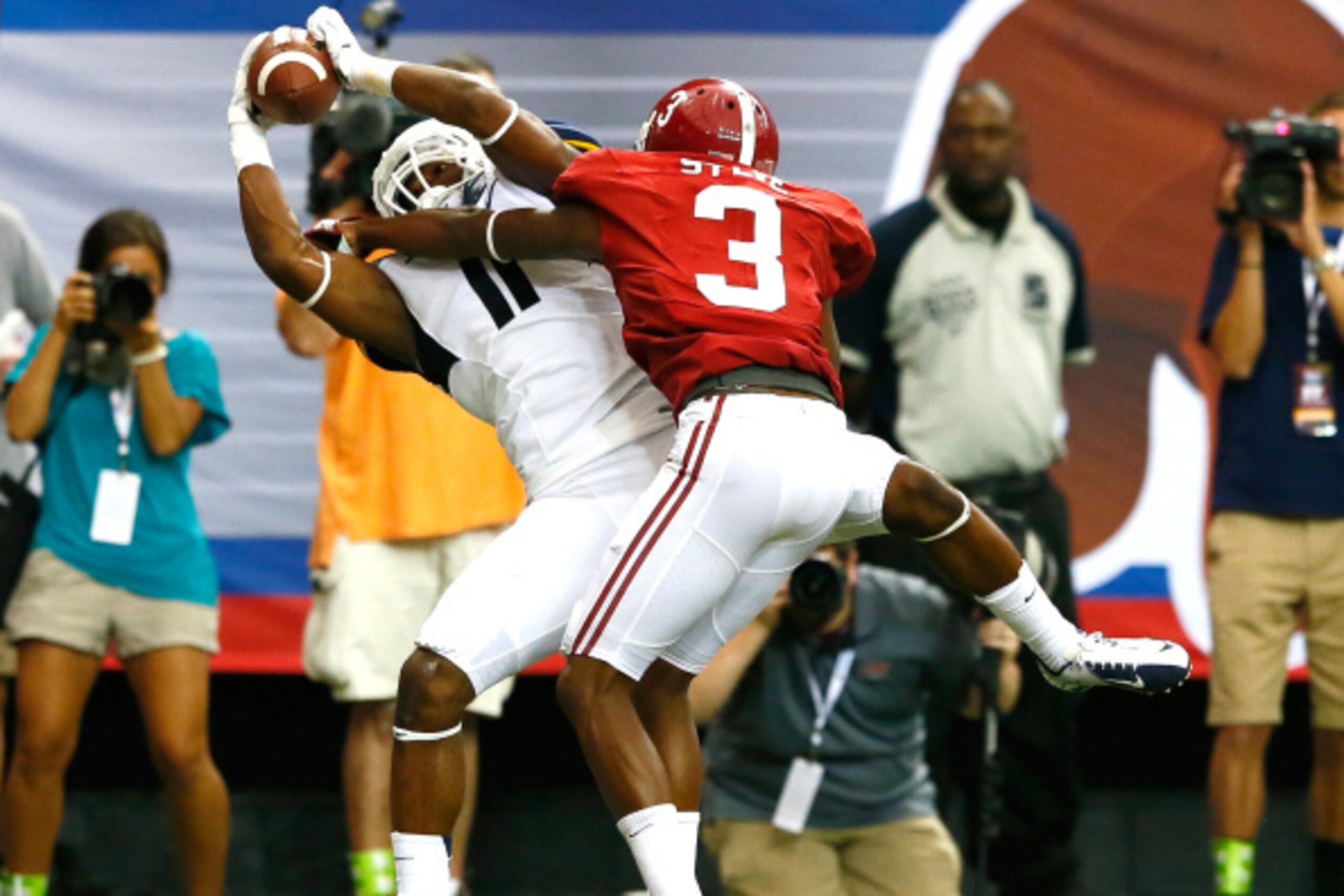ATLANTA, GA - AUGUST 30:  Kevin White #11 of the West Virginia Mountaineers pulls in this touchdown reception against Bradley Sylve #3 of the Alabama Crimson Tide at Georgia Dome on August 30, 2014 in Atlanta, Georgia.  (Photo by Kevin C. Cox/Getty Images