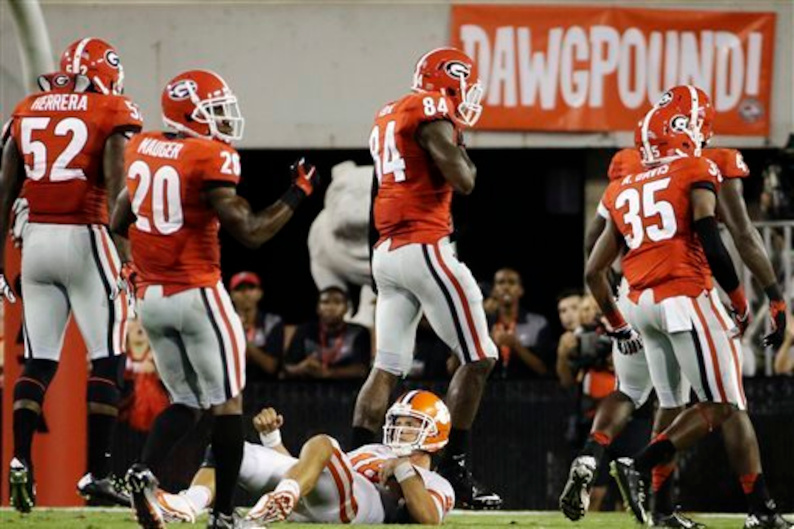 Georgia defenders celebrate a sack.