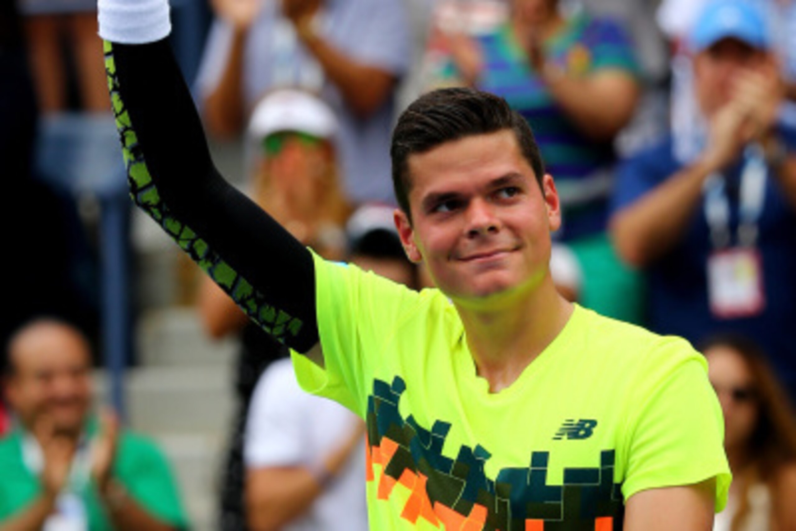 NEW YORK, NY - AUGUST 30:  Milos Raonic of Canada celebrates after defeating Victor Estrella Burgos of the Dominican Republic in their men's singles third round match on Day Six of the 2014 US Open at the USTA Billie Jean King National Tennis Center on Au