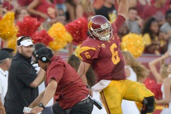 LOS ANGELES, CA - AUGUST 30:  Cody Kessler #6 of the USC Trojans celebrates his touchdown pass for a 52-13 lead over the Fresno State Bulldogs with Head Coach Steve Sarkisian during the third quarter at Los Angeles Memorial Coliseum on August 30, 2014 in 