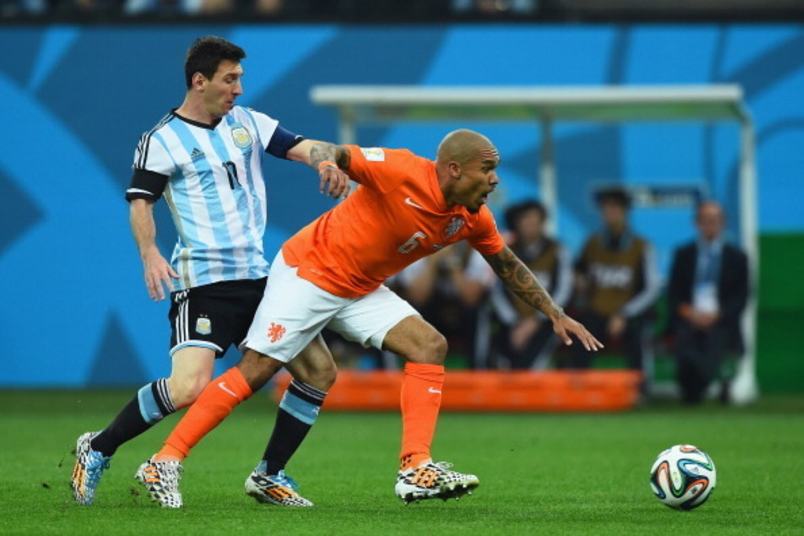 SAO PAULO, BRAZIL - JULY 09: Nigel de Jong of the Netherlands challenges Lionel Messi of Argentina during the 2014 FIFA World Cup Brazil Semi Final match between the Netherlands and Argentina at Arena de Sao Paulo on July 9, 2014 in Sao Paulo, Brazil.  (P