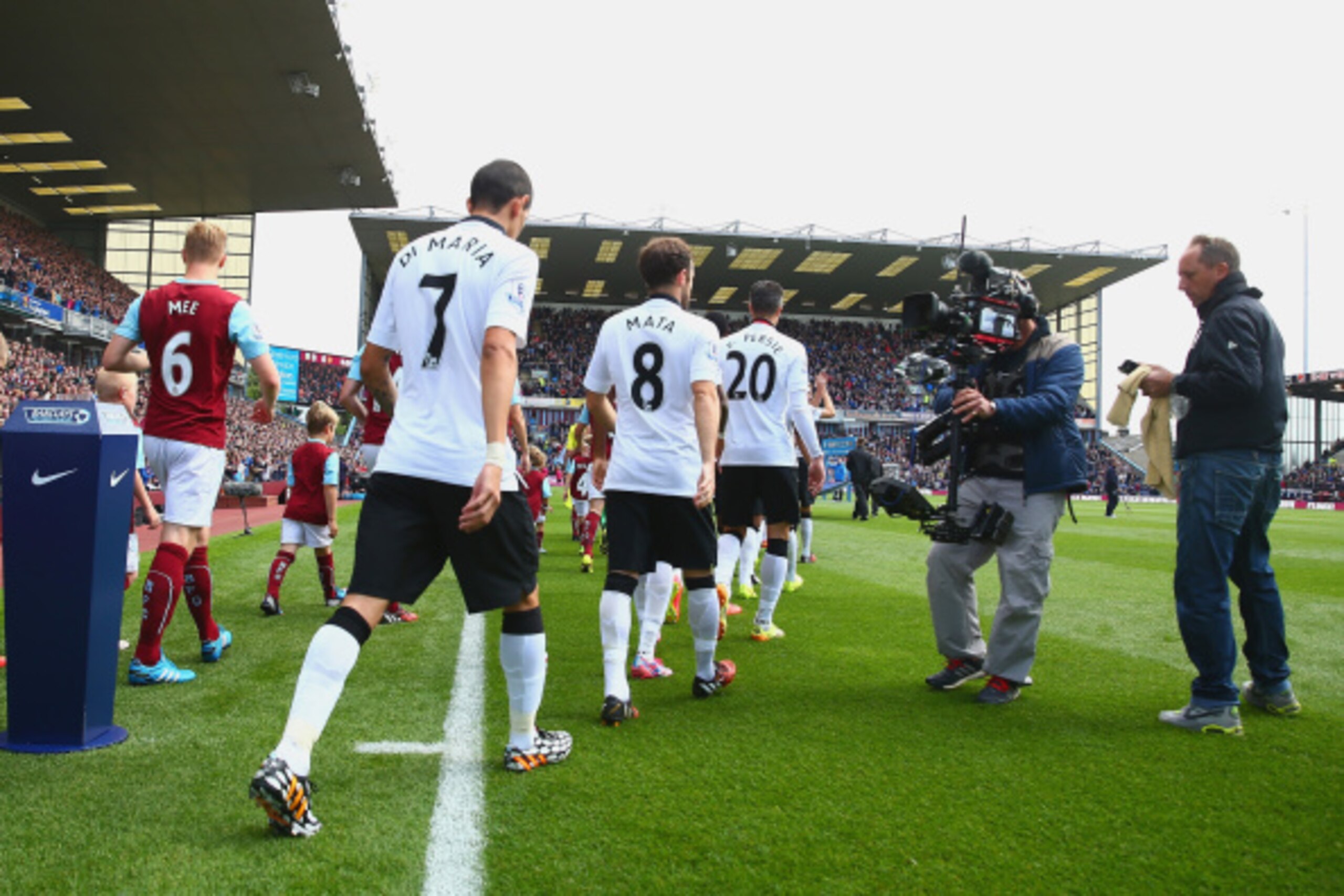 BURNLEY, ENGLAND - AUGUST 30:  Angel di Maria, Juan Mata and Robin van Persie of Manchester United head out at the start of the match during the Barclays Premier League match between Burnley and Manchester United at Turf Moor on August 30, 2014 in Burnley