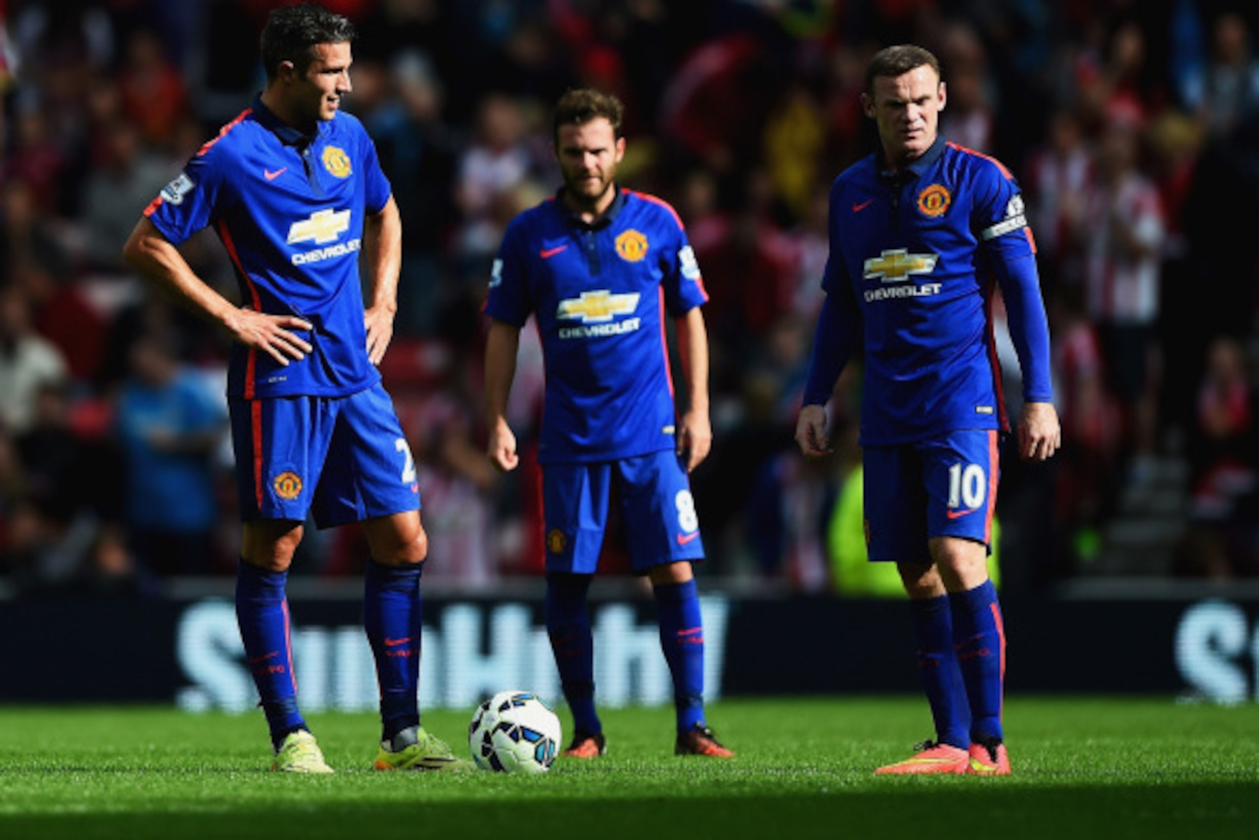 SUNDERLAND, ENGLAND - AUGUST 24:  Robin van Persie (L), Juan Mata and Wayne Rooney of Manchester United look dejected after the goal scored by Jack Rodwell of Sunderland during the Barclays Premier League match between Sunderland and Manchester United at 