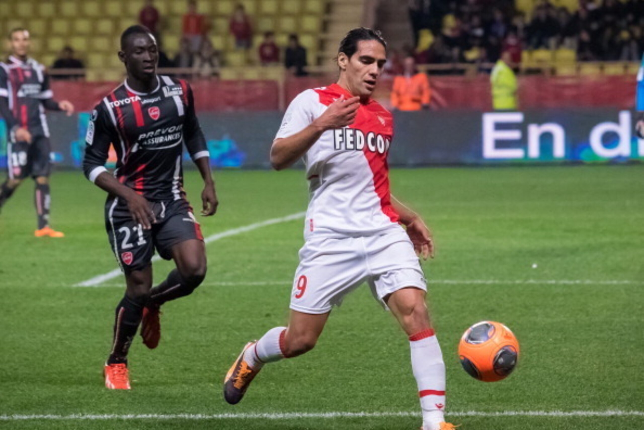 MONTE-CARLO, MONACO - DECEMBER 20:  Monaco's foward Radamel Falcao (R) challenges Valenciennes's defender Saliou Ciss (L)  during the French L1 football match between AS Monaco vs Valenciennes at Louis II Stadium on December 20, 2013 in Monte-Carlo, Monac