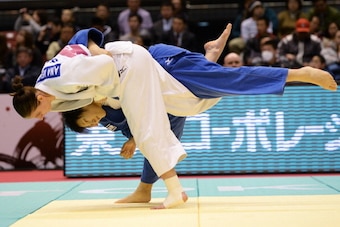 TOKYO, JAPAN - DECEMBER 01:  Anamari Velensek (white) of Slovania and Tomomi Okamura of Japan compete in the women's -78kg round 2 during day three of the Judo Grand Slam at the  on December 1, 2013 in Tokyo, Japan.  (Photo by Atsushi Tomura/Getty Images)