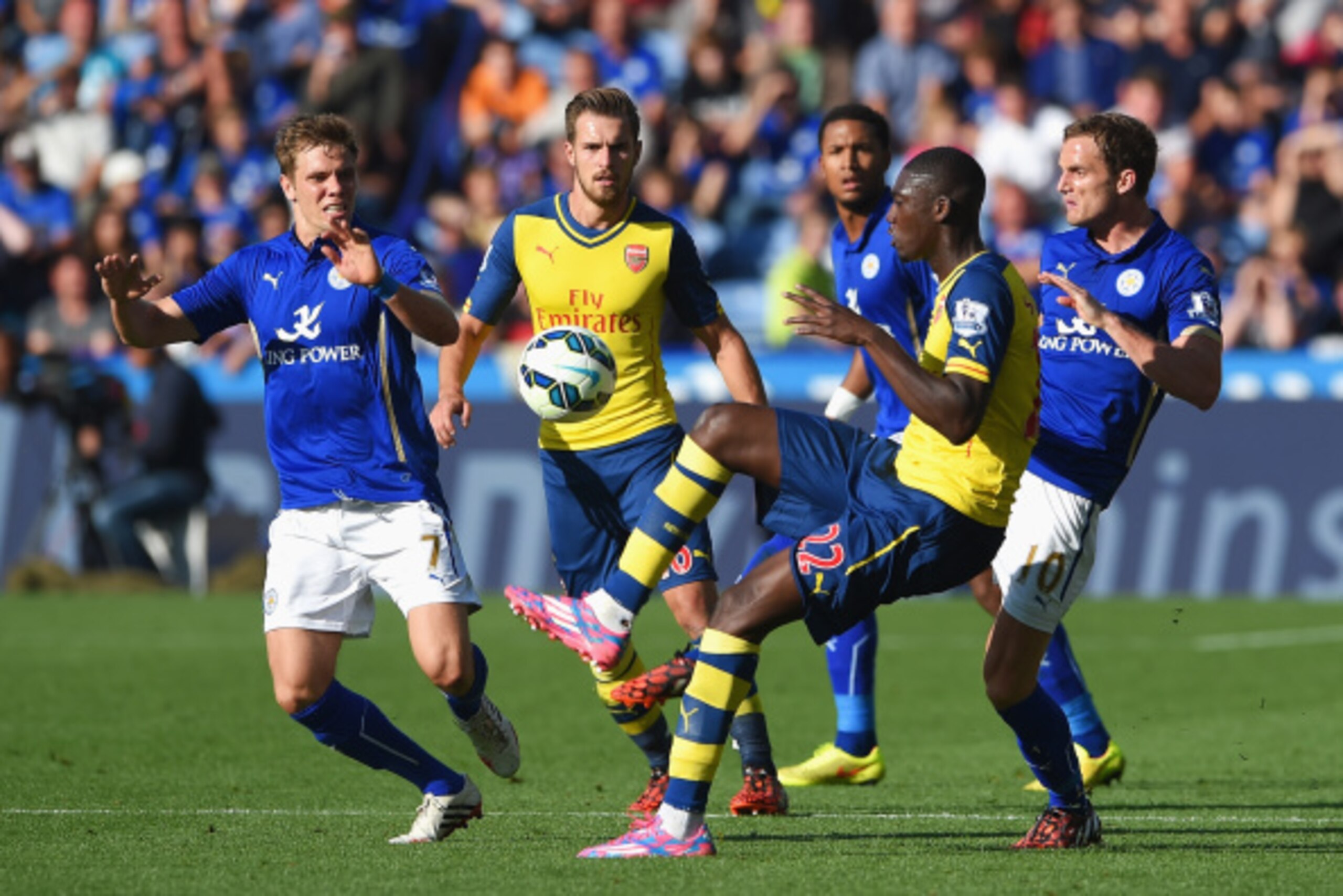 LEICESTER, ENGLAND - AUGUST 31: Yaya Sanogo of Arsenal controls the ball watched by (L-R) Dean Hammond of Leicester City, Aaron Ramsey of Arsenal, Liam Moore and Andy King of Leicester City during the Barclays Premier League match between Leicester City a