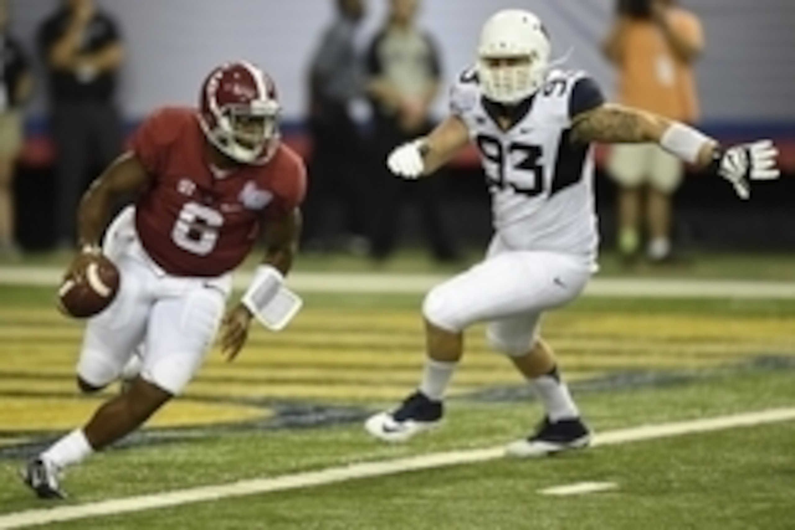 Aug 30, 2014; Atlanta, GA, USA; Alabama Crimson Tide quarterback Blake Sims (6) scrambles against West Virginia Mountaineers defensive lineman Kyle Rose (93) during the second quarter of the 2014 Chick-fil-a kickoff game at Georgia Dome. Mandatory Credit: