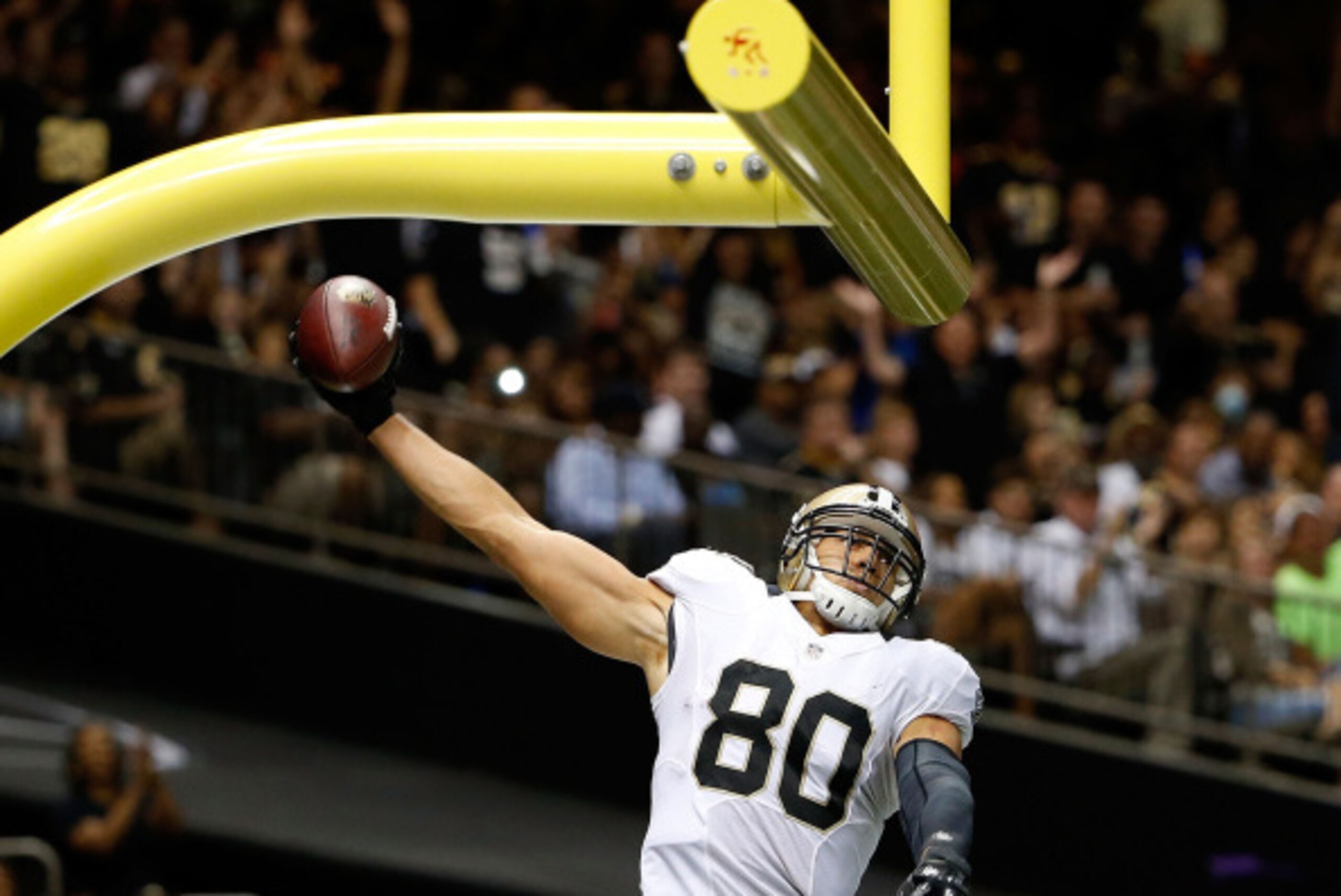NEW ORLEANS, LA - AUGUST 15:  Jimmy Graham #80 of the New Orleans Saints celebrates a touchdown during a preseason game against the Tennessee Titans at the Mercedes-Benz Superdome on August 15, 2014 in New Orleans, Louisiana.  (Photo by Stacy Revere/Getty