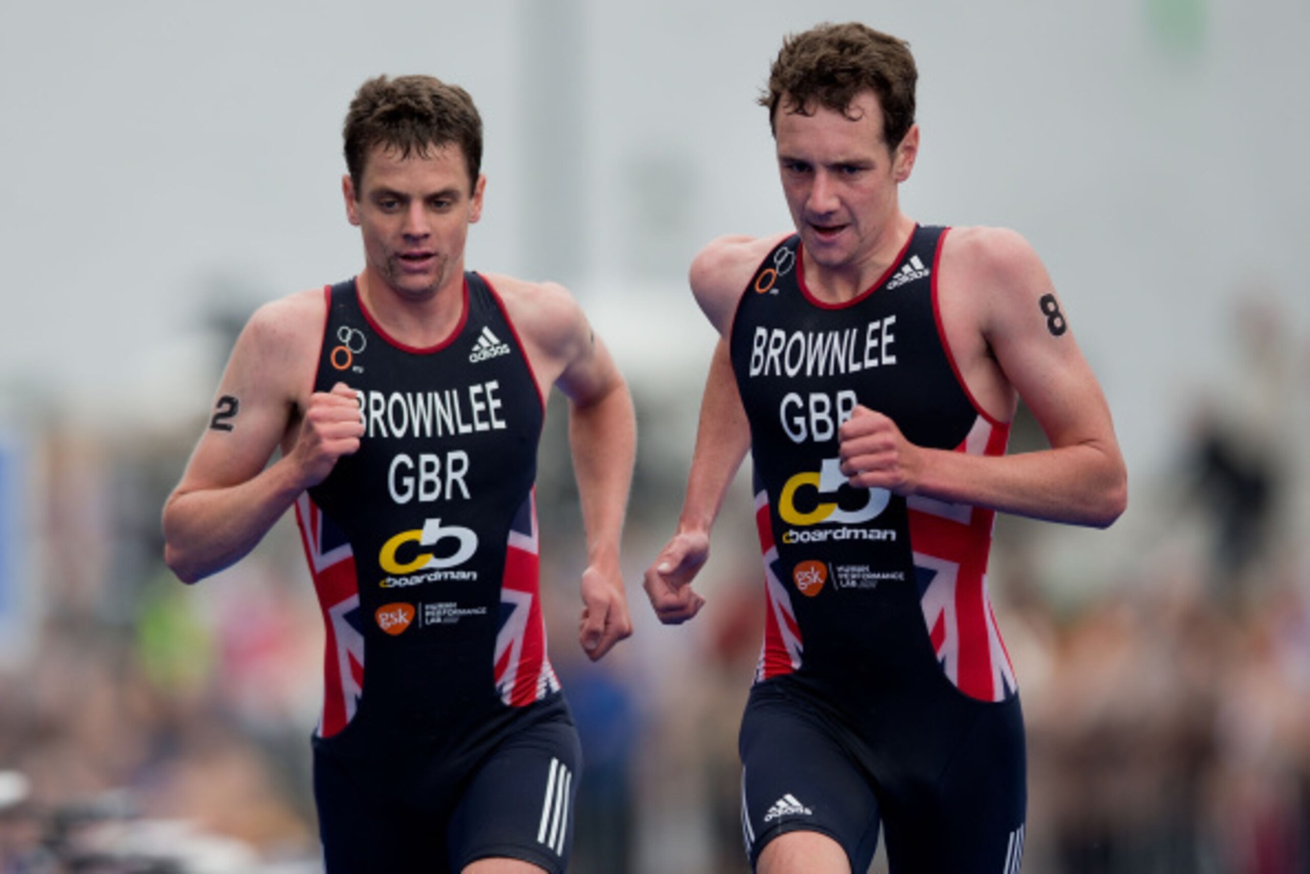 STOCKHOLM, SWEDEN - AUGUST 23: Elite Men Sprint Race winner Jonathan Brownlee (L) from great Britain competes with his teammate Alistair Brownlee (R) on the running course at the ITU World Triathlon on August 23, 2014 in Stockholm, Sweden. (Photo by Gonza