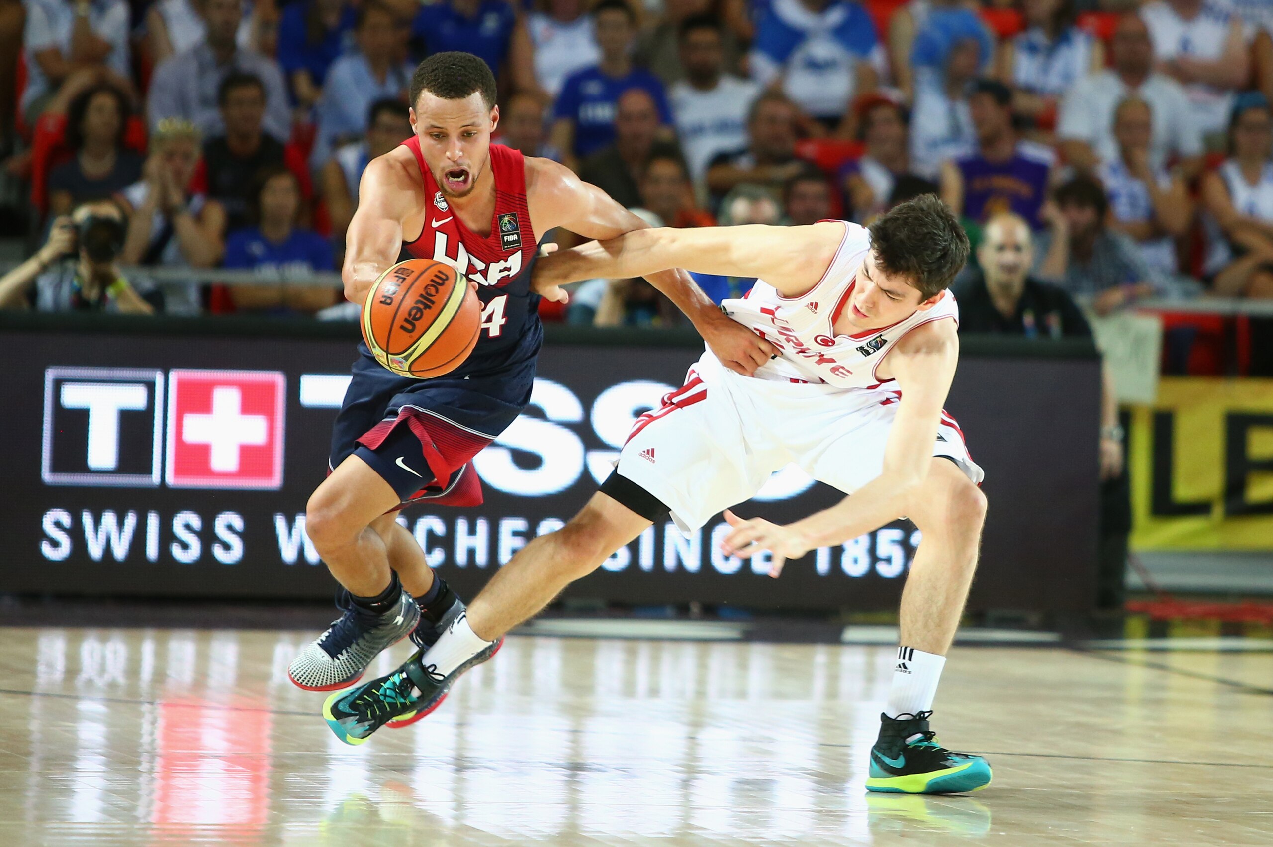 BILBAO, SPAIN - AUGUST 31: Stephen Curry #4 of the USA Basketball Men's National Team fights for the ball against Cedi Osman #4 the Turkey Basketball Men's National Team during the 2014 FIBA World Cup at Bizkaia Arena in Bilbao Exhibition Centre on August