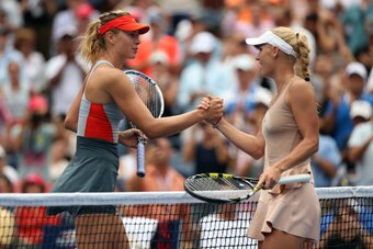 NEW YORK, NY - AUGUST 31:  Caroline Wozniacki of Denmark meets Maria Sharapova of Russia after winning their women's singles fourth round match on Day Seven of the 2014 US Open at the USTA Billie Jean King National Tennis Center on August 31, 2014 in the 