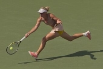 Aug 31, 2014; New York, NY, USA; Caroline Wozniacki (DEN) in action during her match against Maria Sharapova (RUS) on day seven of the 2014 U.S. Open tennis tournament at USTA Billie Jean King National Tennis Center. Mandatory Credit: Susan Mullane-USA TO