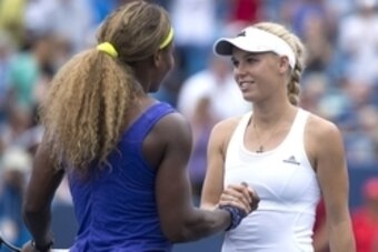 Aug 16, 2014; Cincinnati, OH, USA; Serena Williams (left) meets Caroline Wozniacki (right) at center court on day six of the Western and Southern Open tennis tournament at Linder Family Tennis Center. Mandatory Credit: Aaron Doster-USA TODAY Sports
