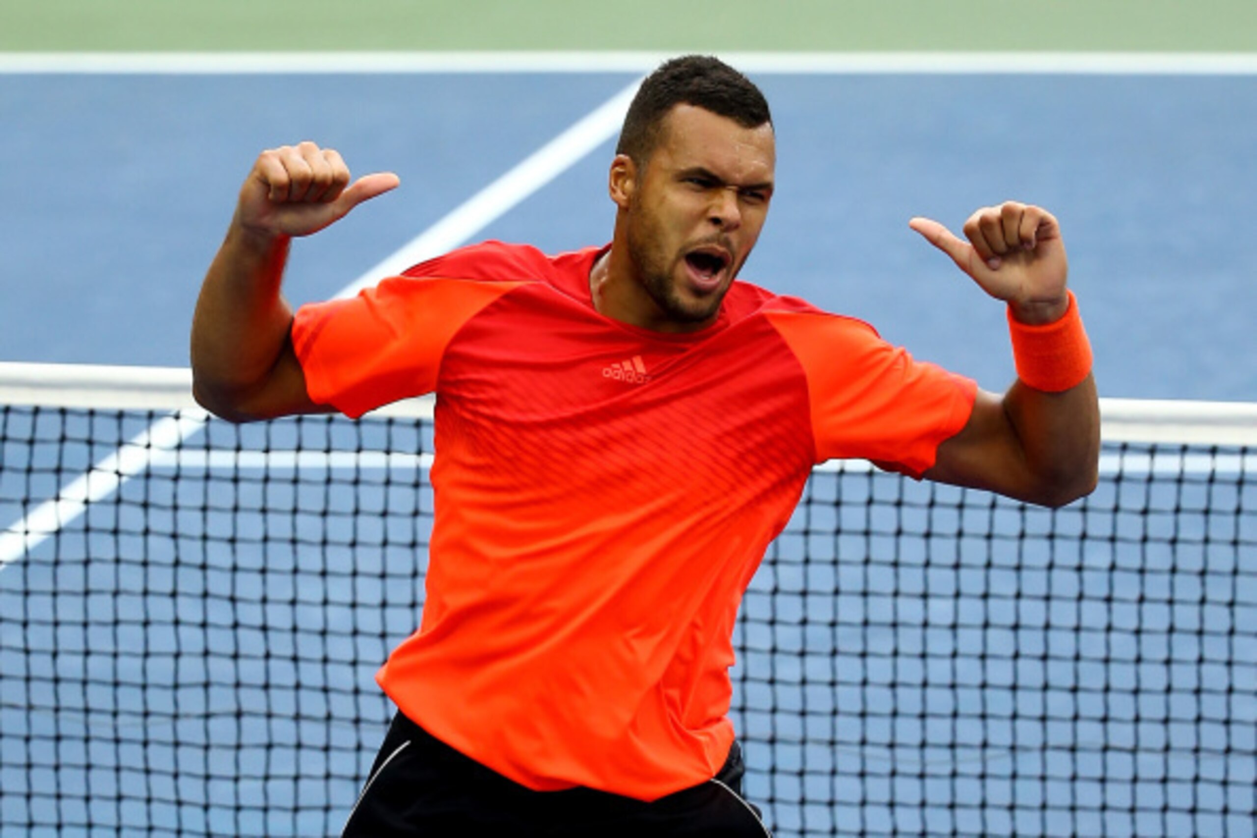 NEW YORK, NY - AUGUST 30:  Jo-Wilfried Tsonga of France celebrates after defeating  Pablo Carreno Busta of Spain in their men's singles third round match on Day Six of the 2014 US Open at the USTA Billie Jean King National Tennis Center on August 30, 2014