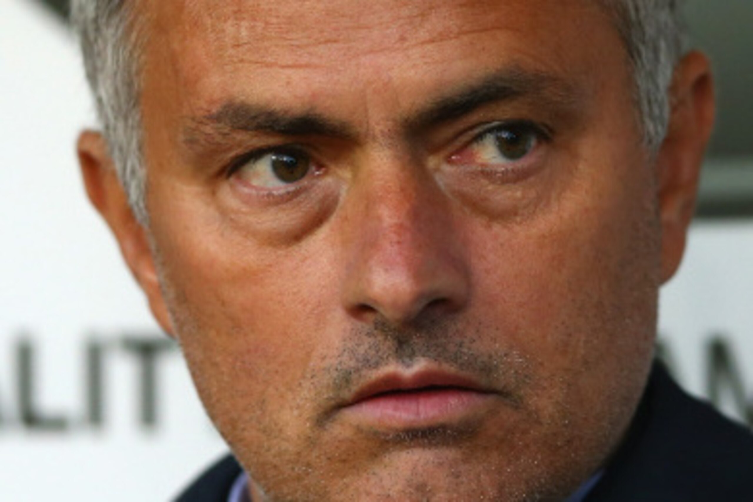 BURNLEY, ENGLAND - AUGUST 18:  Chelsea manager Jose Mourinho in the dug out prior to the Barclays Premier League match between Burnley and Chelsea at Turf Moor on August 18, 2014 in Burnley, England.  (Photo by Clive Brunskill/Getty Images)